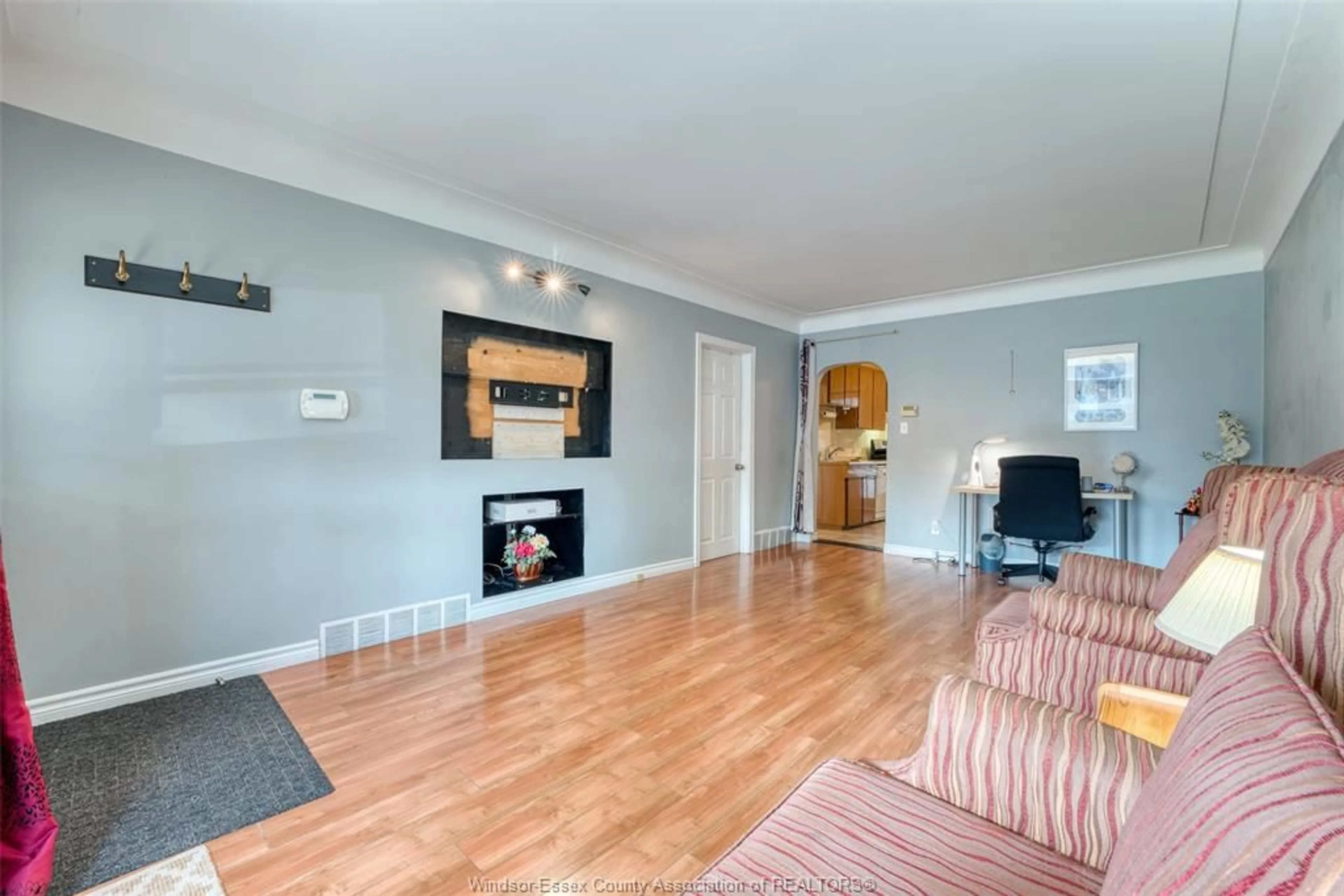 Living room with furniture, wood/laminate floor for 1794 GLADSTONE Ave, Windsor Ontario N8W 2N3