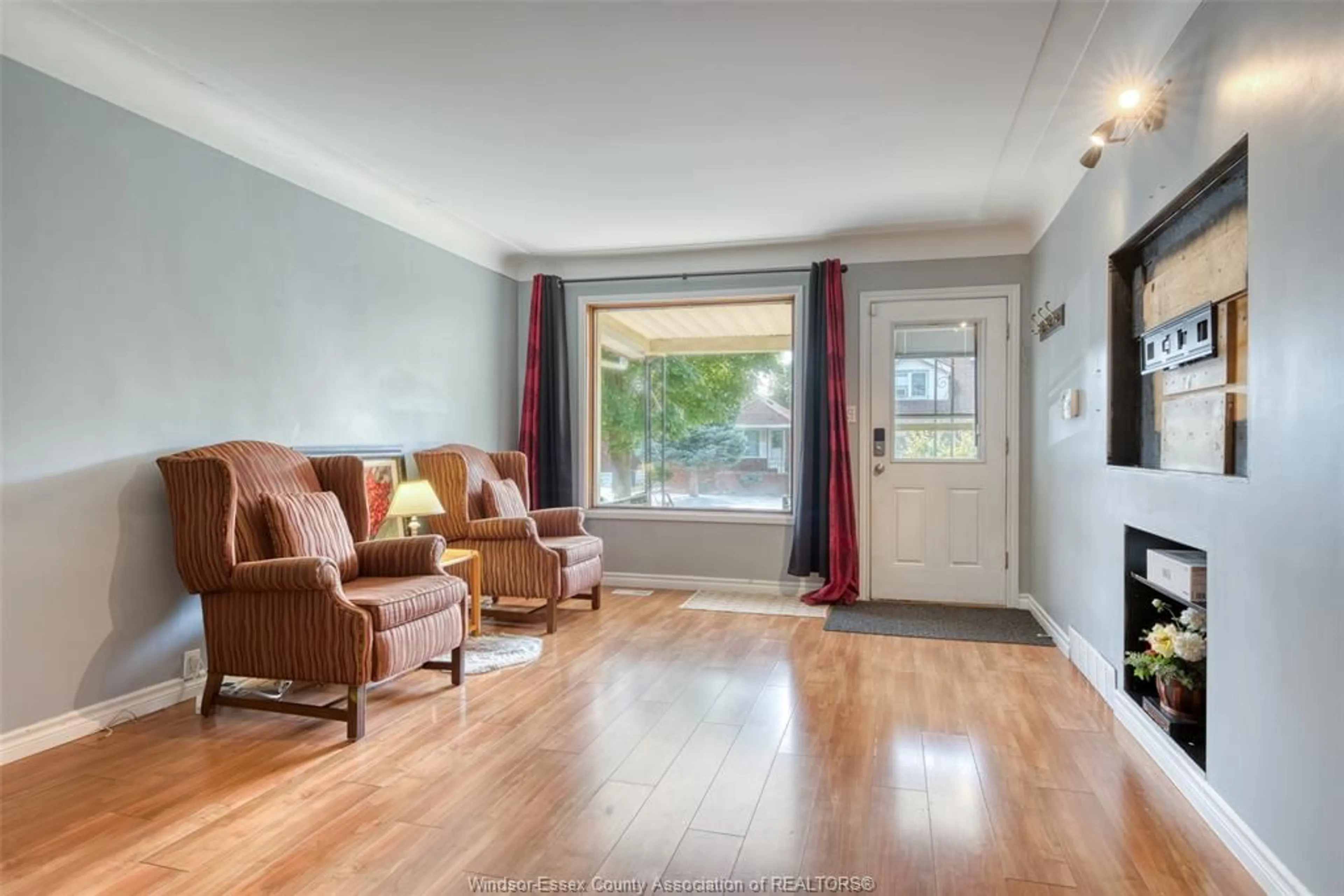Living room with furniture, wood/laminate floor for 1794 GLADSTONE Ave, Windsor Ontario N8W 2N3