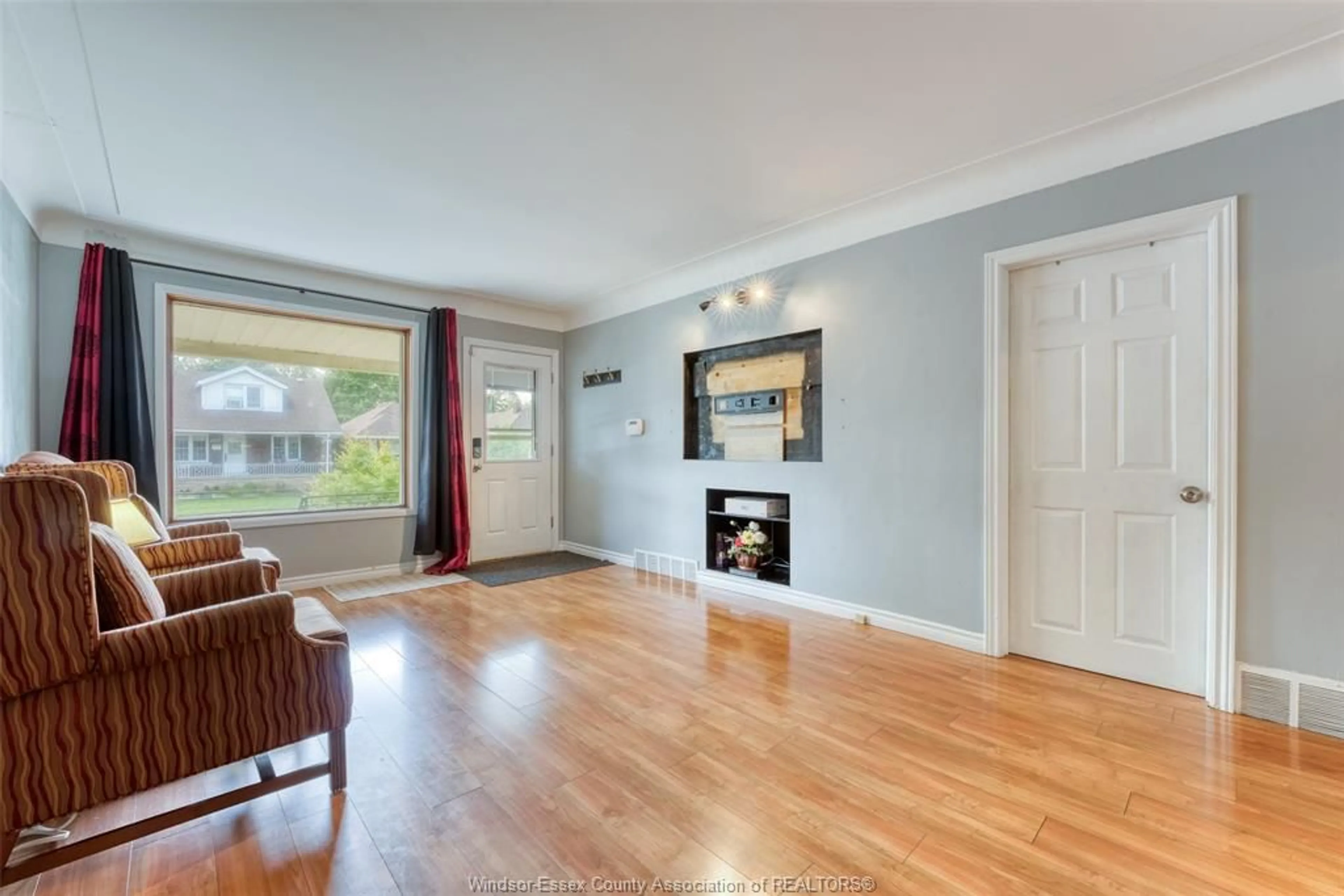 Living room with furniture, wood/laminate floor for 1794 GLADSTONE Ave, Windsor Ontario N8W 2N3