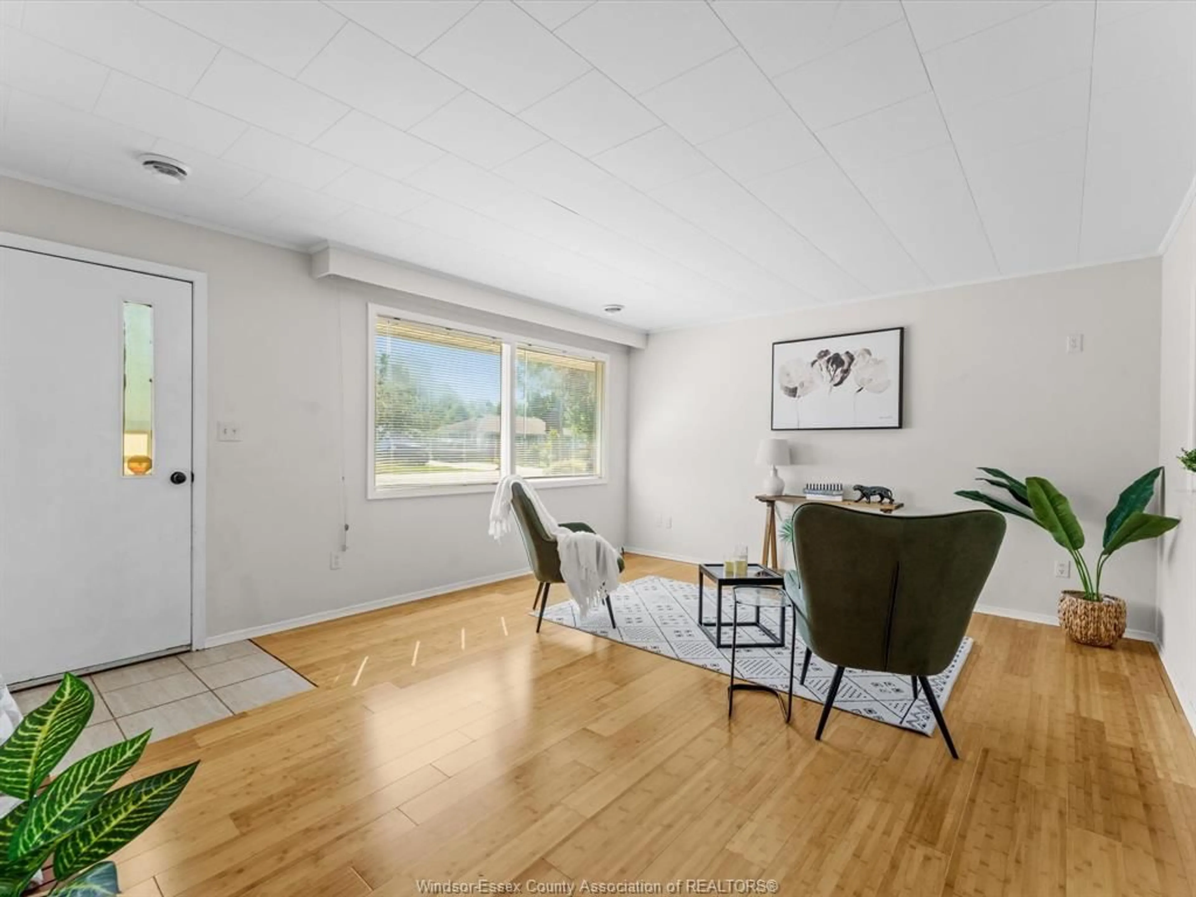 Living room with furniture, wood/laminate floor for 1825 Sabo St, Kingsville Ontario N9Y 3A4