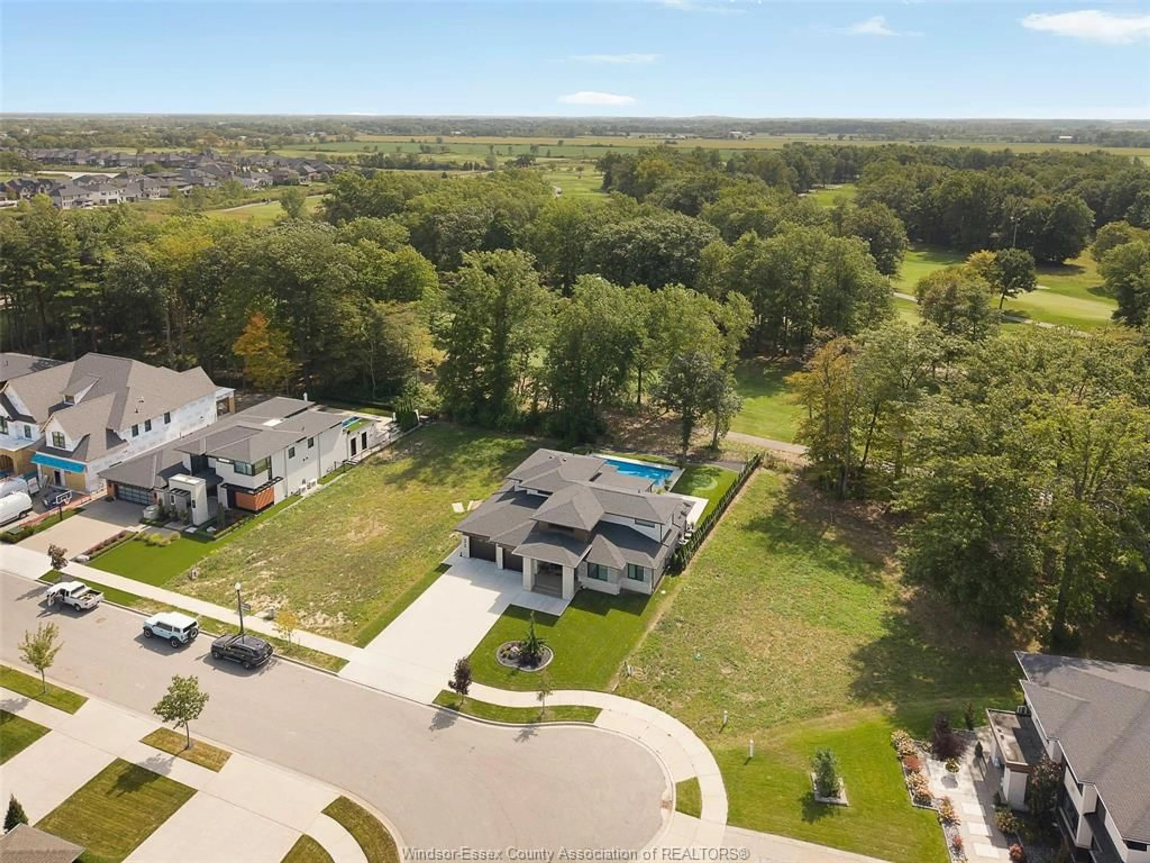 A pic from outside/outdoor area/front of a property/back of a property/a pic from drone, water/lake/river/ocean view for 5068 WHISPERING PINES, LaSalle Ontario N9H 0E5