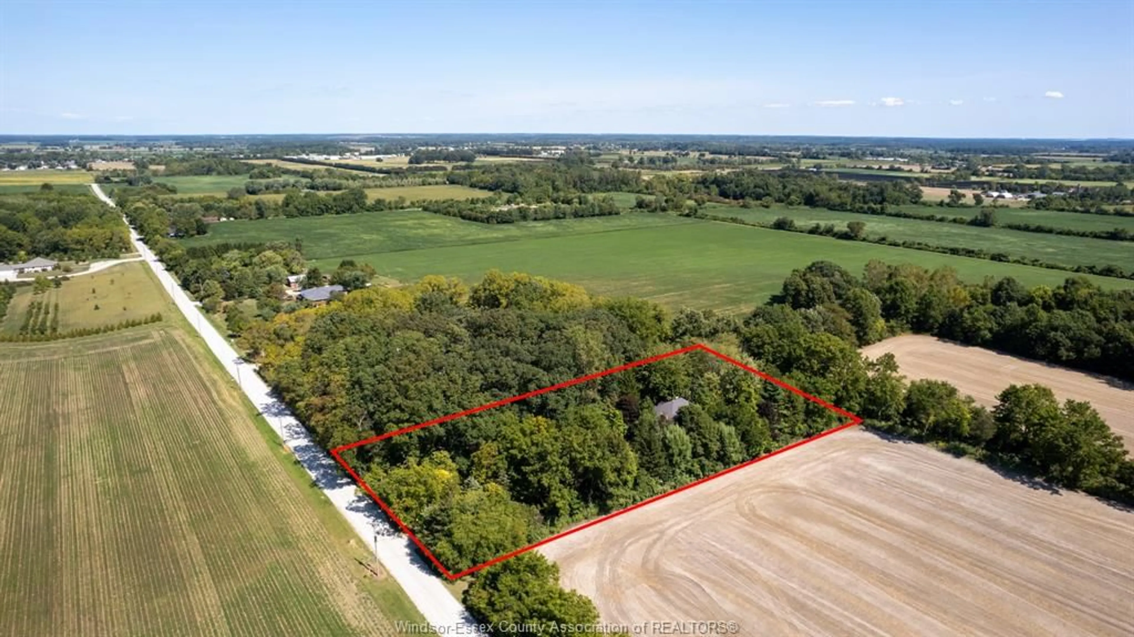 A pic from outside/outdoor area/front of a property/back of a property/a pic from drone, forest/trees view for 1110 SNAKE Lane, Harrow Ontario N0R 1G0