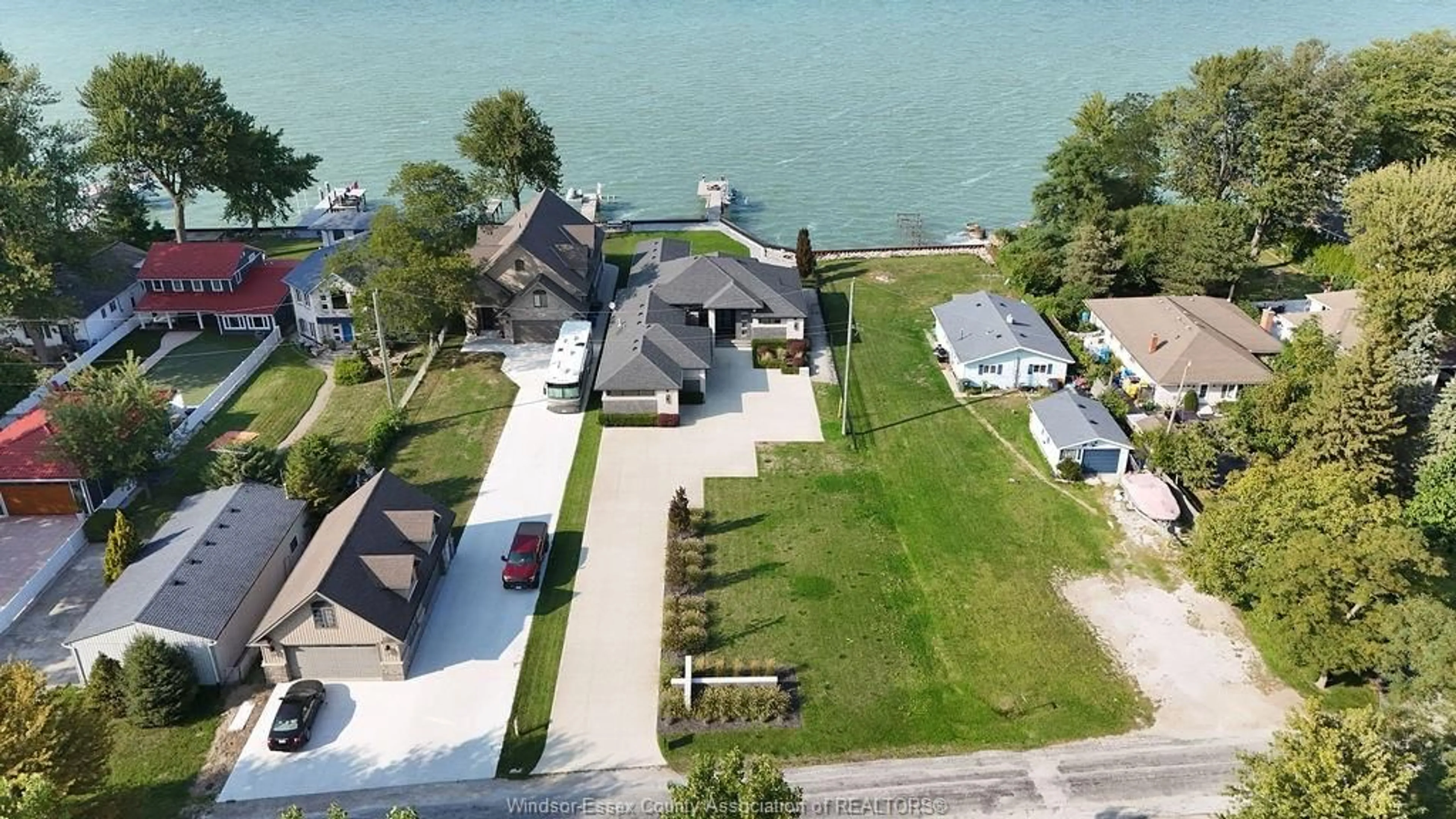 A pic from outside/outdoor area/front of a property/back of a property/a pic from drone, water/lake/river/ocean view for 371 CHARRON BEACH, Lakeshore Ontario N8L 0G2
