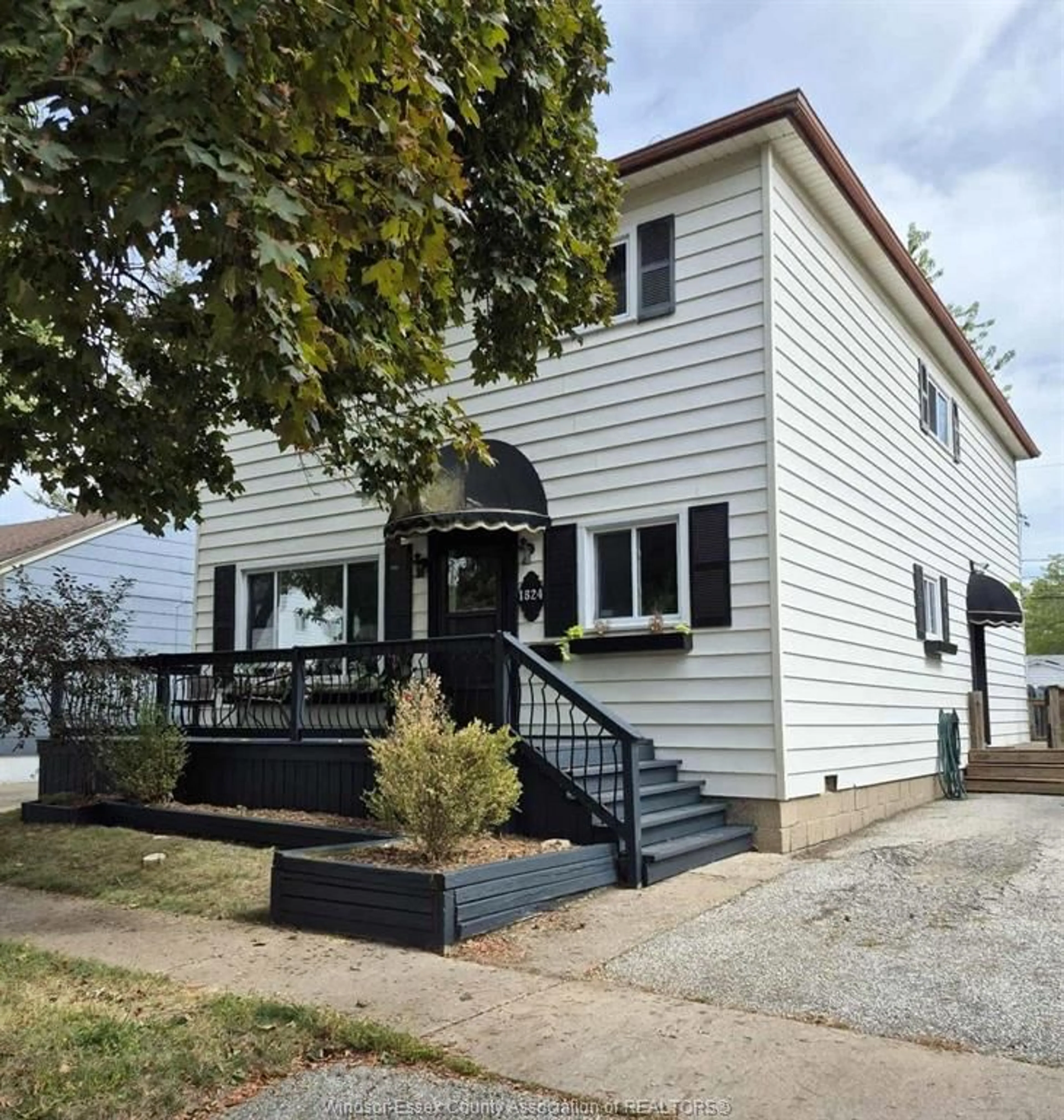 Home with vinyl exterior material, street for 1824 WESTCOTT Rd, Windsor Ontario N8W 4K2