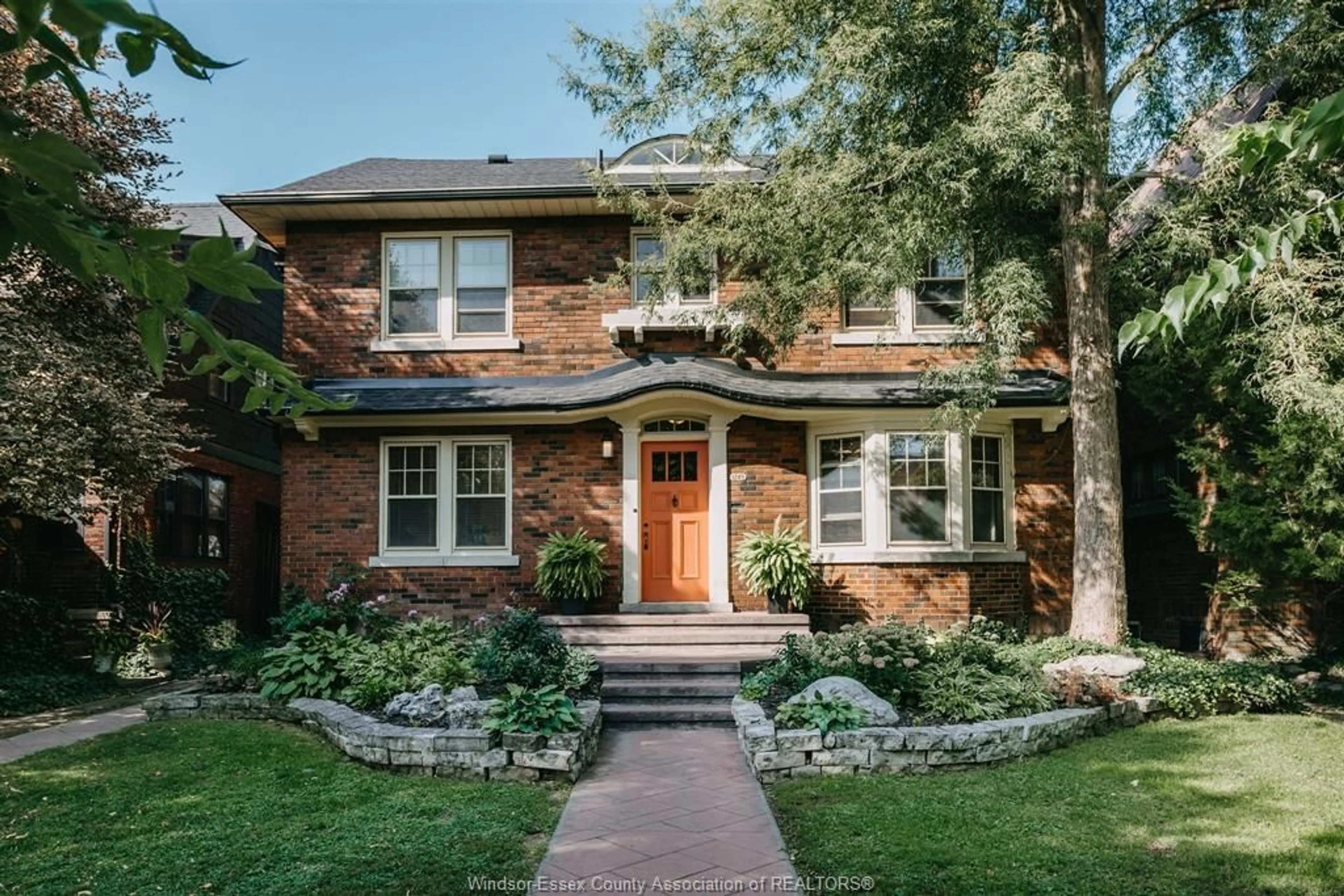 Home with brick exterior material, street for 1245 Kildare Rd, Windsor Ontario N8Y 3H7