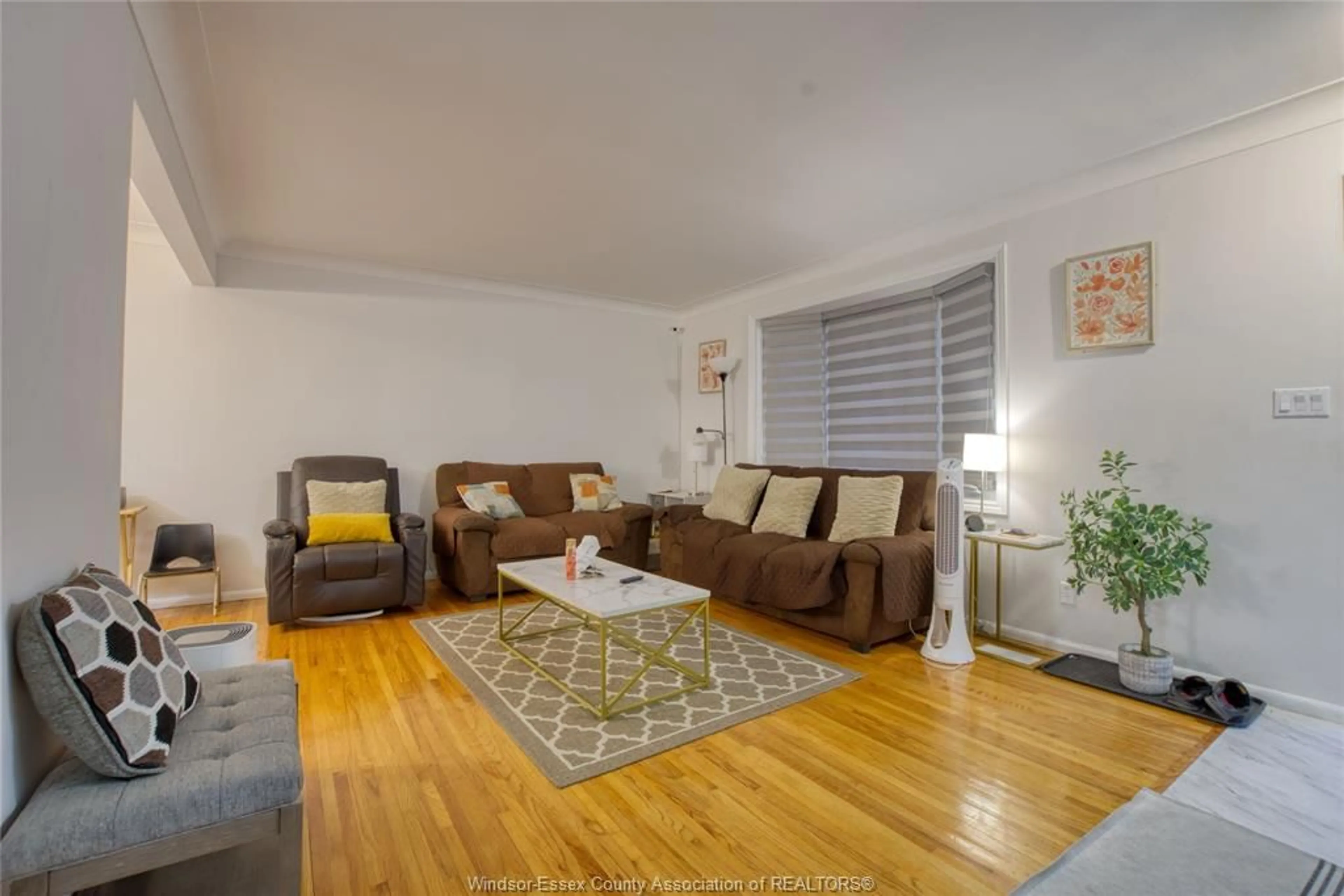 Living room with furniture, wood/laminate floor for 881 LOUNSBOROUGH, Windsor Ontario N9G 1G2
