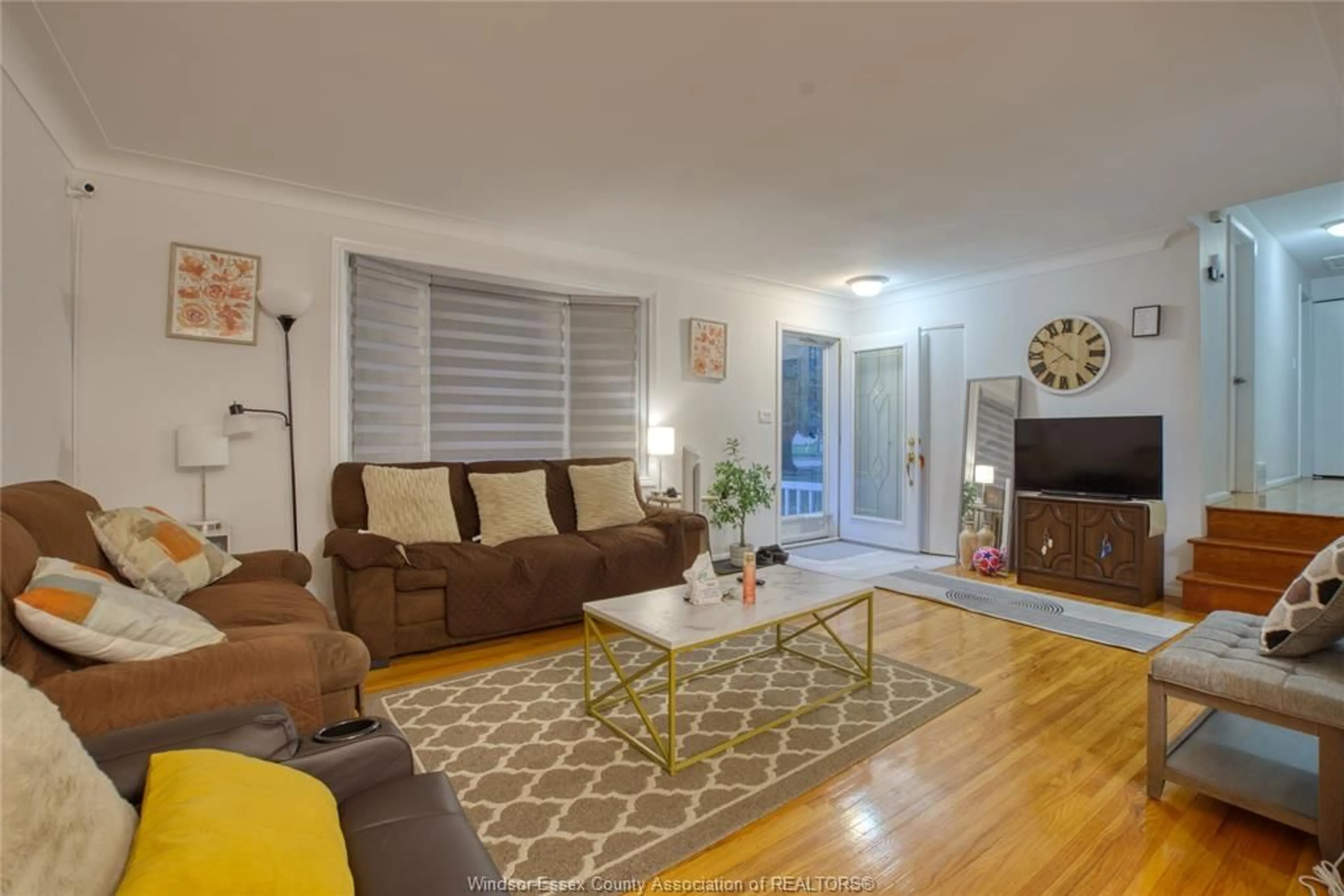 Living room with furniture, wood/laminate floor for 881 LOUNSBOROUGH, Windsor Ontario N9G 1G2