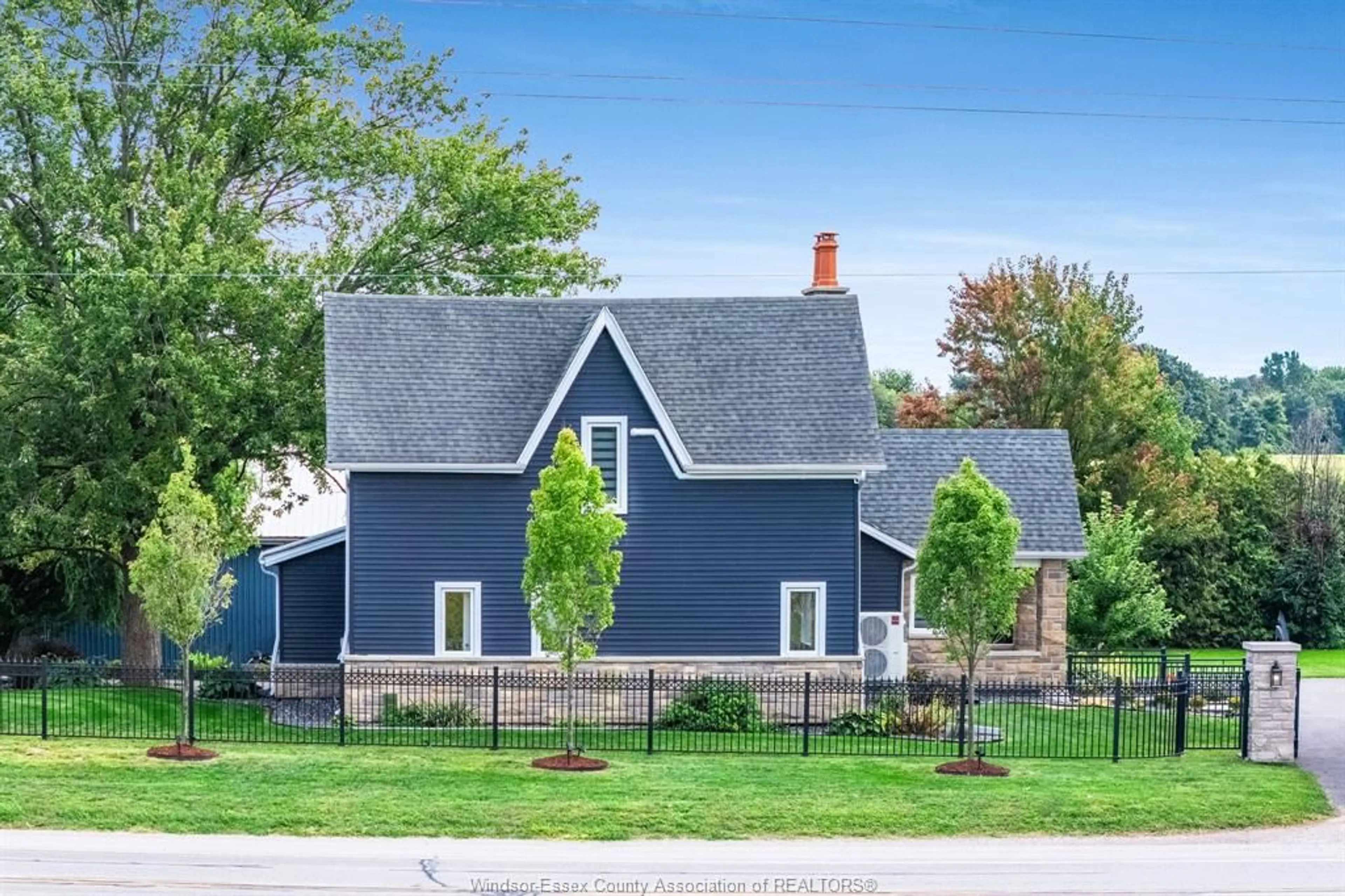 Home with vinyl exterior material, street for 702 Talbot Rd, Wheatley Ontario N0P 2P0
