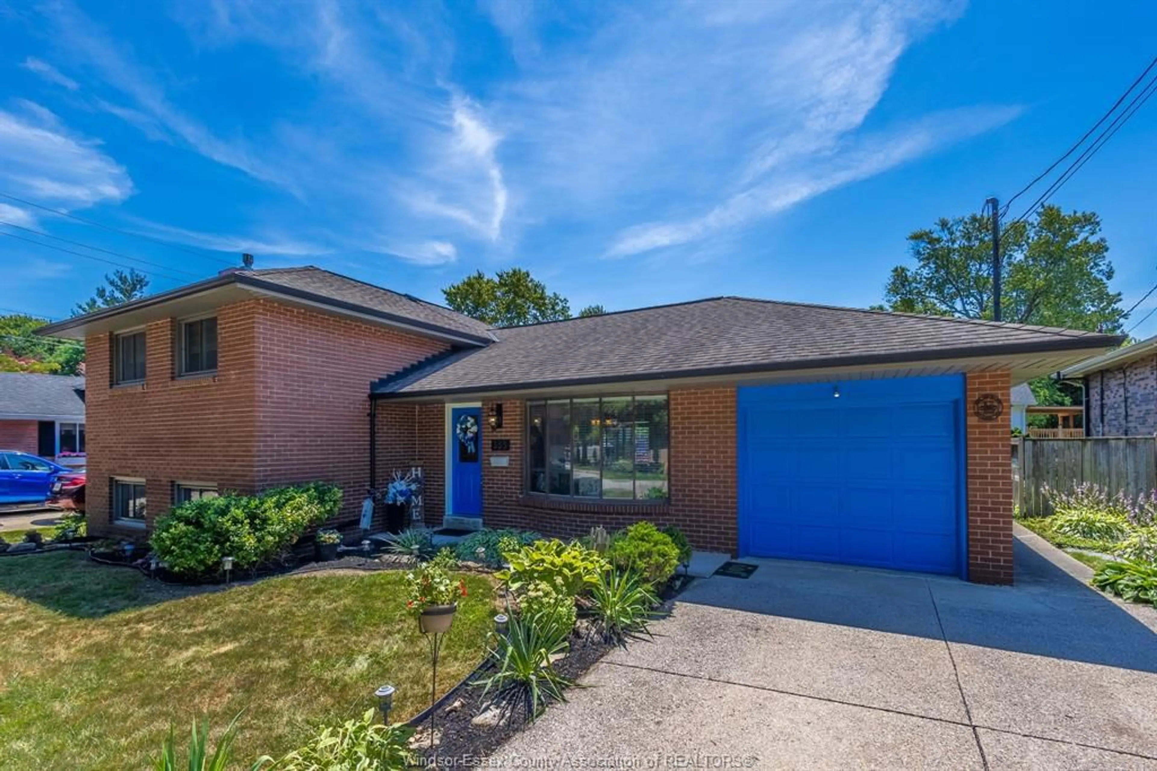 Home with brick exterior material, street for 353 Cousineau Rd, Windsor Ontario N9G 1V6