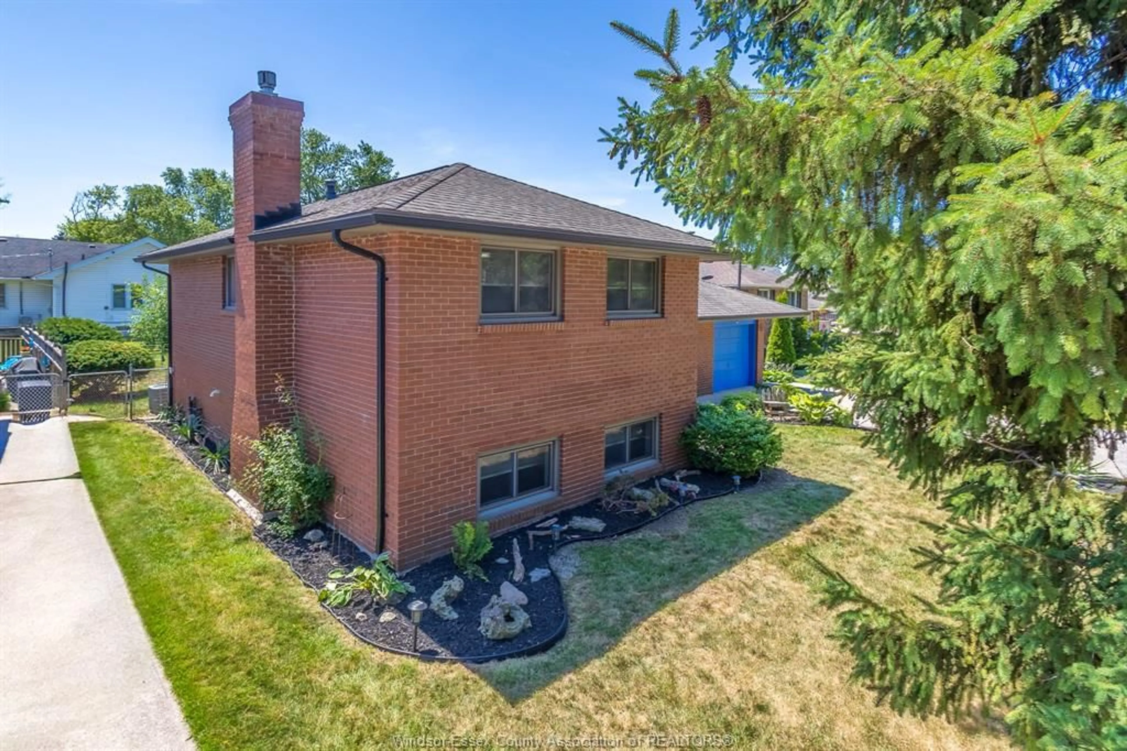 Home with brick exterior material, street for 353 Cousineau Rd, Windsor Ontario N9G 1V6