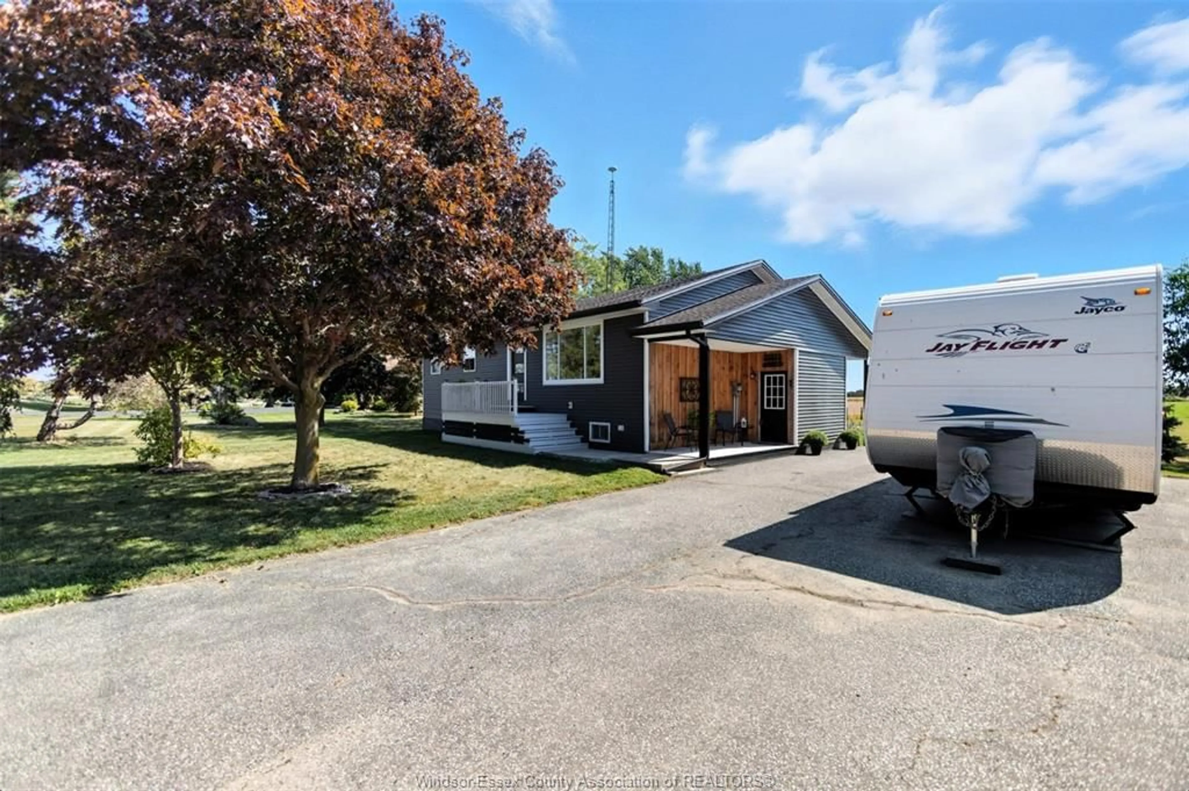 A pic from outside/outdoor area/front of a property/back of a property/a pic from drone, street for 1732 MERSEA RD D, Leamington Ontario N8H 3V4