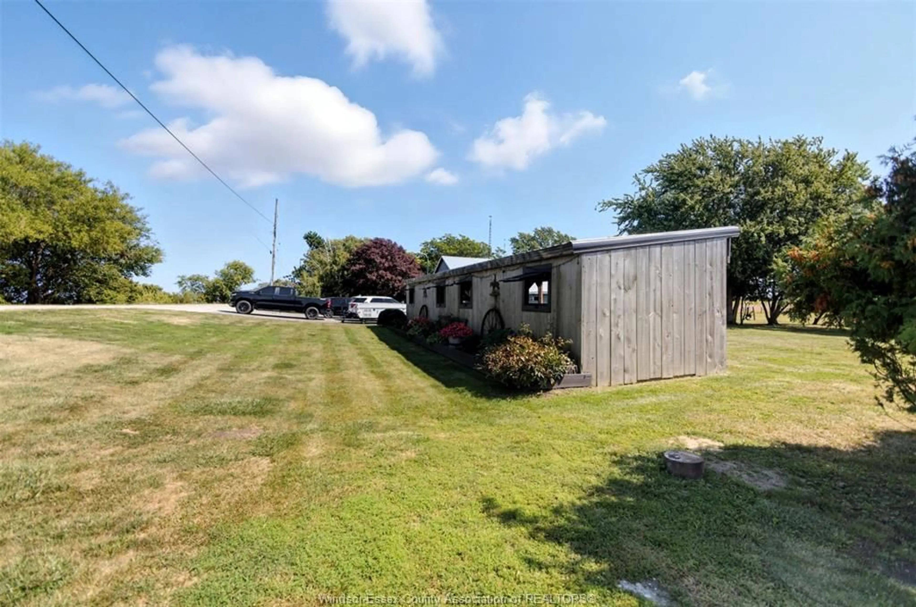 A pic from outside/outdoor area/front of a property/back of a property/a pic from drone, unknown for 1732 MERSEA RD D, Leamington Ontario N8H 3V4