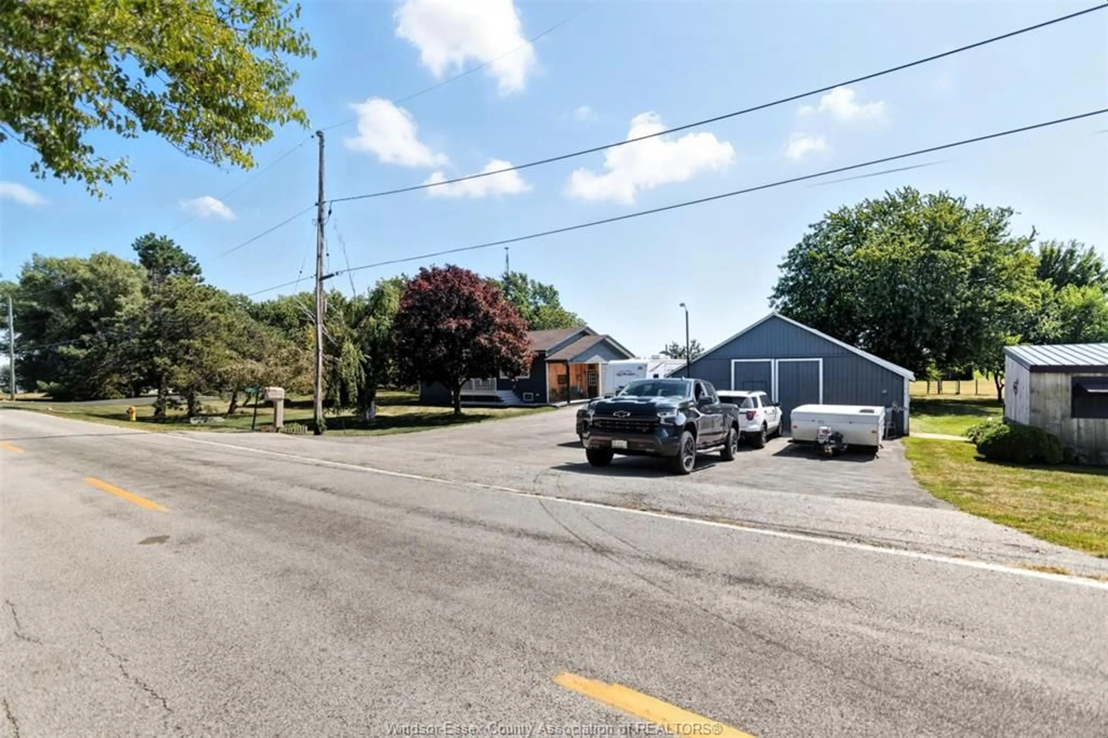 A pic from outside/outdoor area/front of a property/back of a property/a pic from drone, street for 1732 MERSEA RD D, Leamington Ontario N8H 3V4