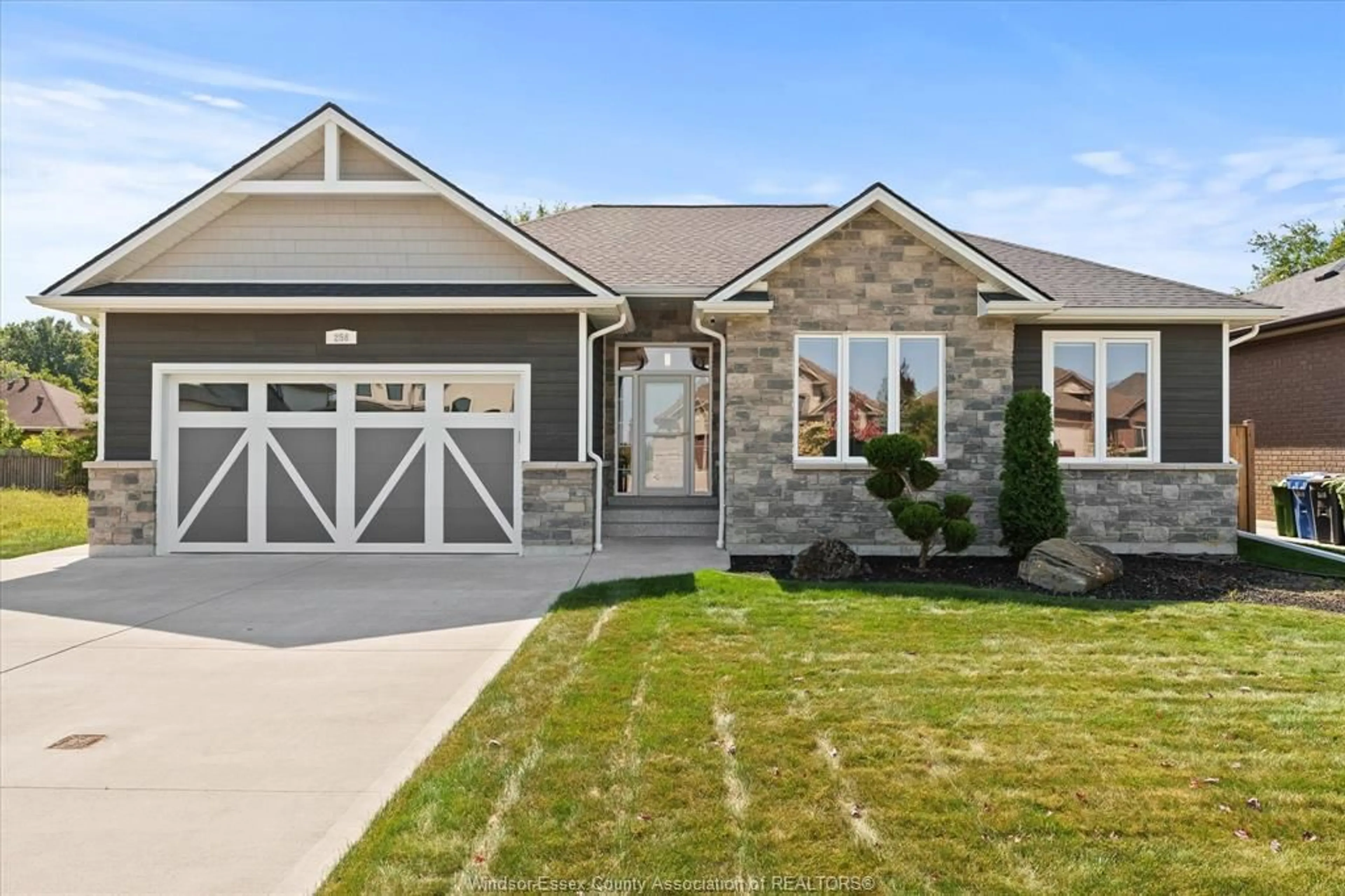 Home with brick exterior material, street for 256 Joan Flood Drive, Essex Ontario N8M 0C6