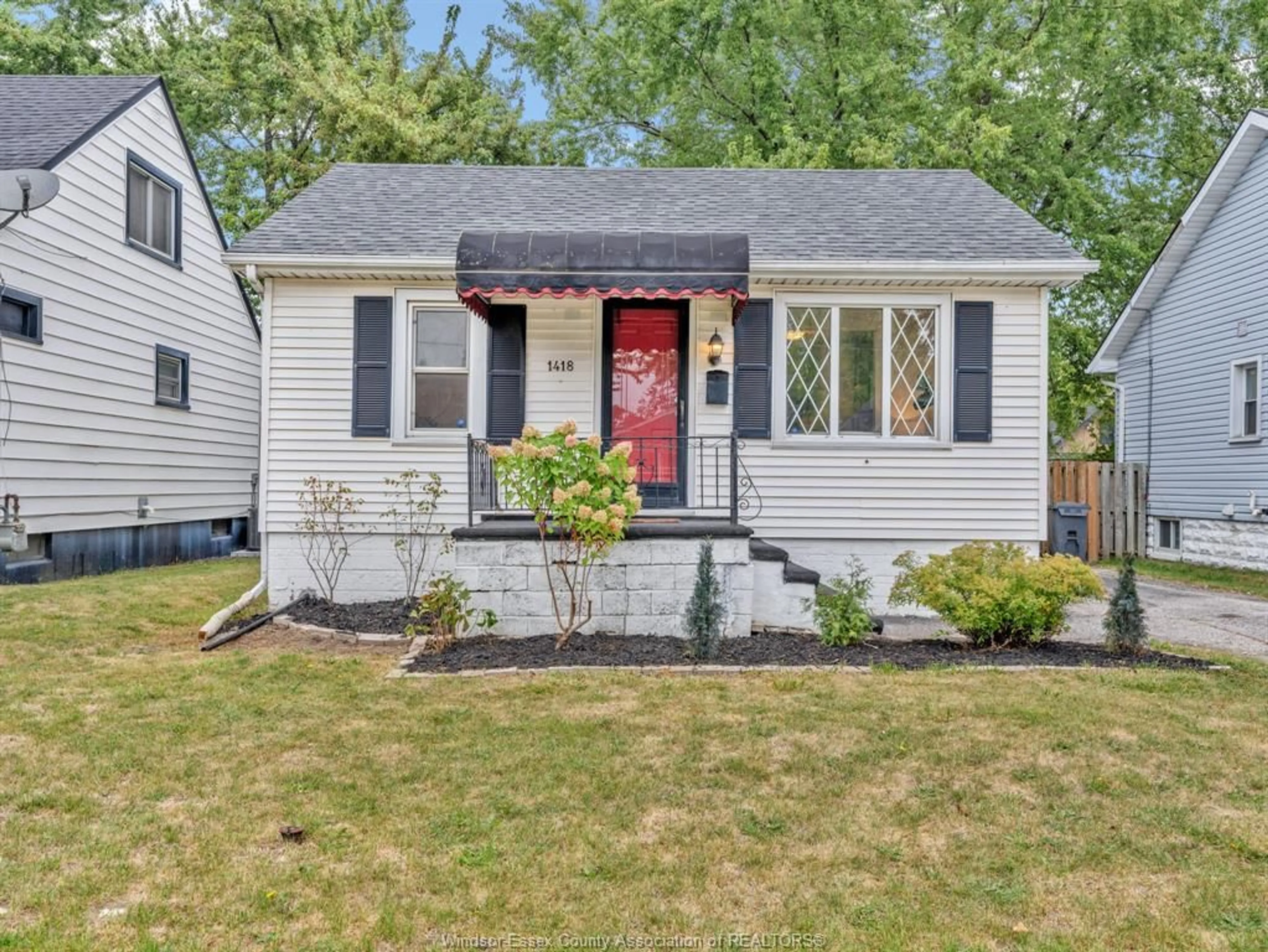 Home with vinyl exterior material, street for 1418 ELLROSE Ave, Windsor Ontario N8Y 3X3