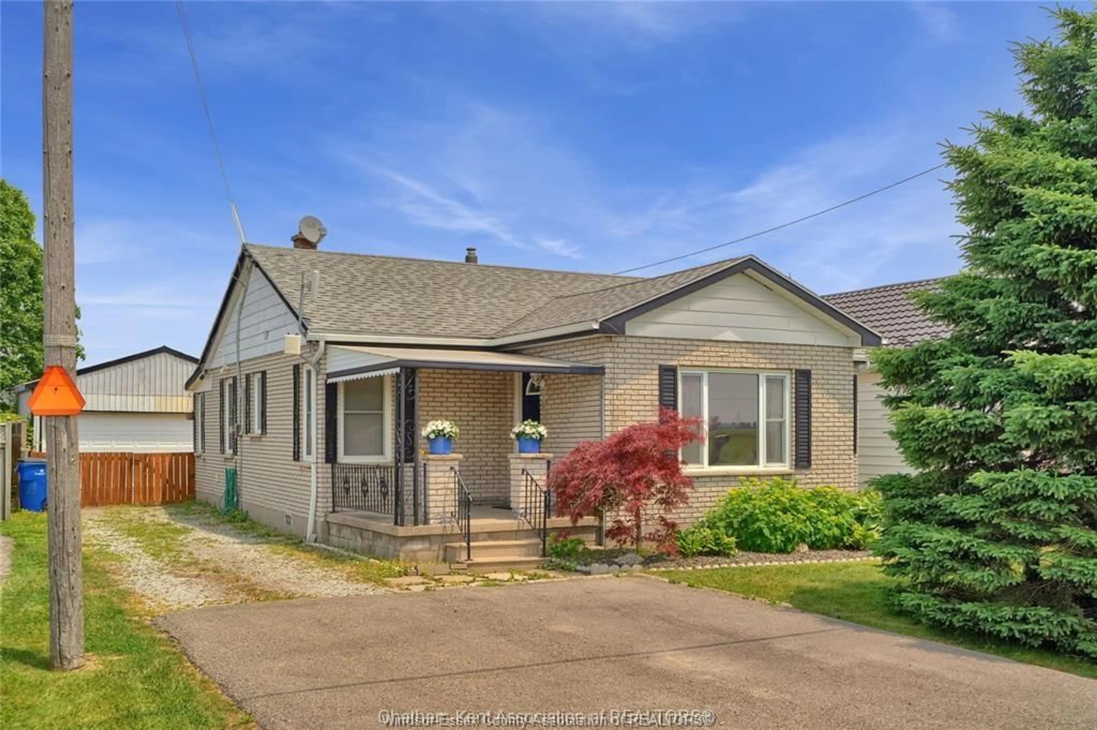 Home with vinyl exterior material, street for 22415 CREEK Rd, Chatham Ontario N7M 5J3