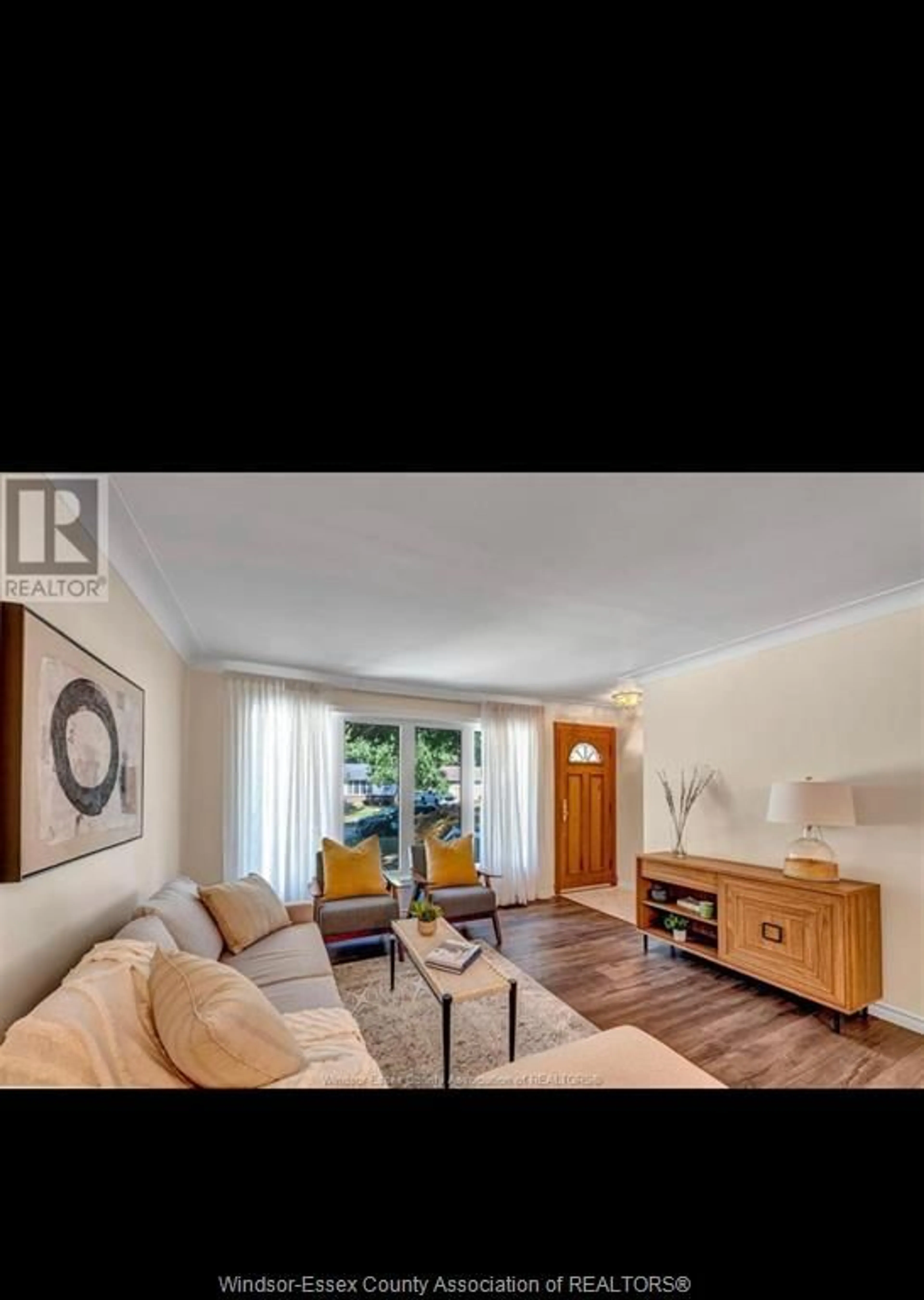Living room with furniture, wood/laminate floor for 3455 RANDOLPH Ave, Windsor Ontario N9E 3E9