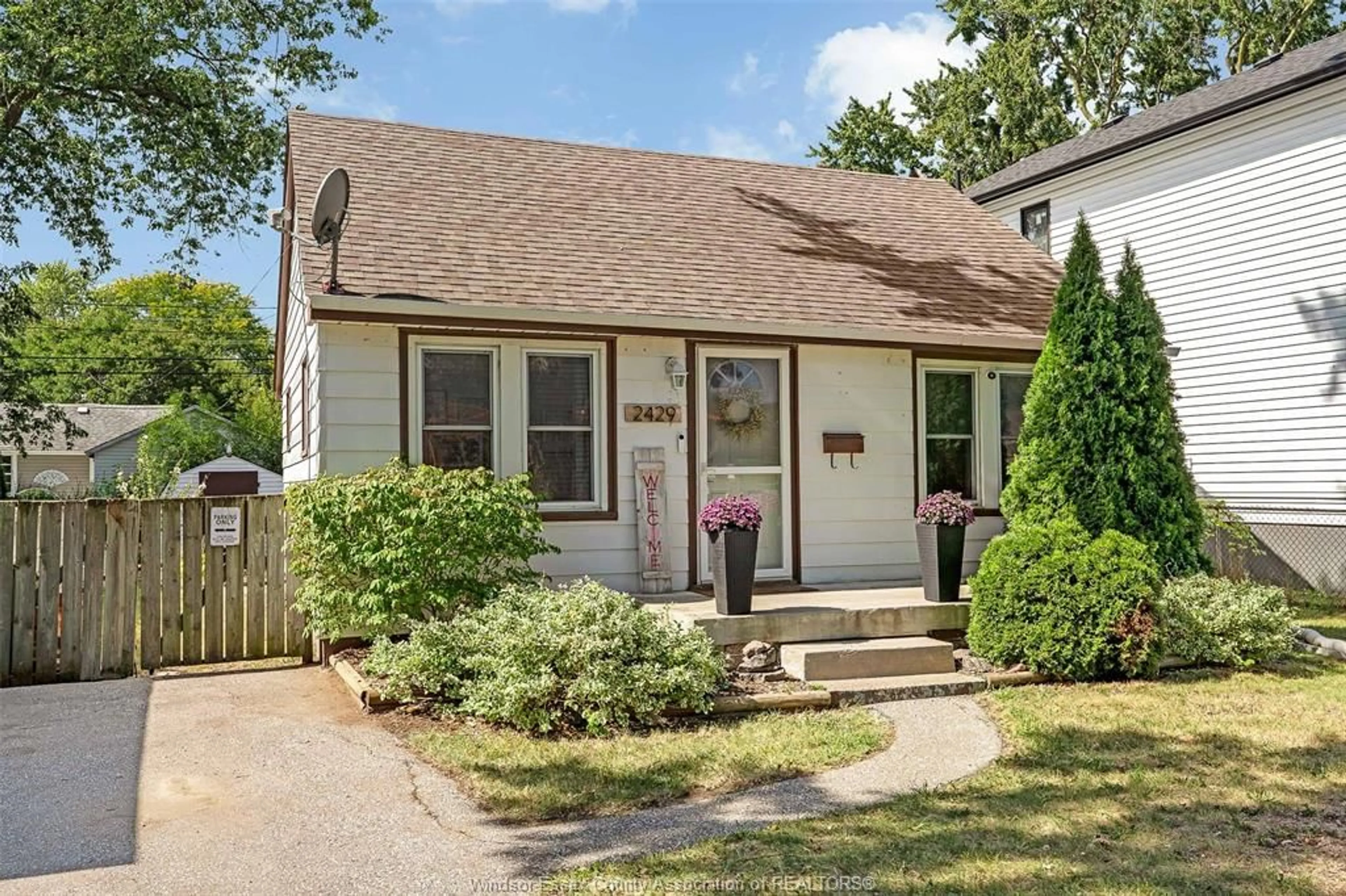 Home with vinyl exterior material, street for 2429 TOURANGEAU, Windsor Ontario N8W 4N8