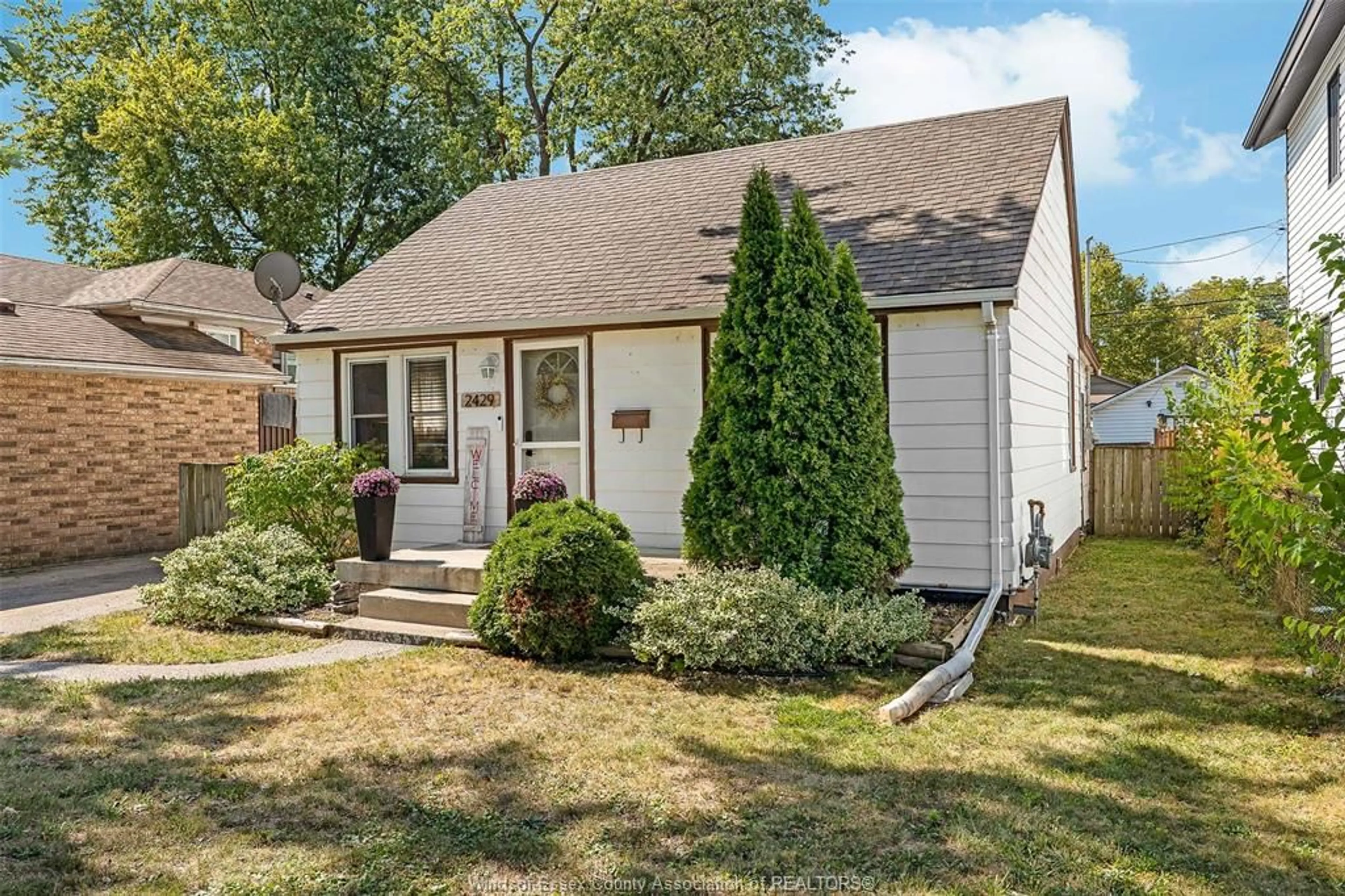 Home with vinyl exterior material, street for 2429 TOURANGEAU, Windsor Ontario N8W 4N8