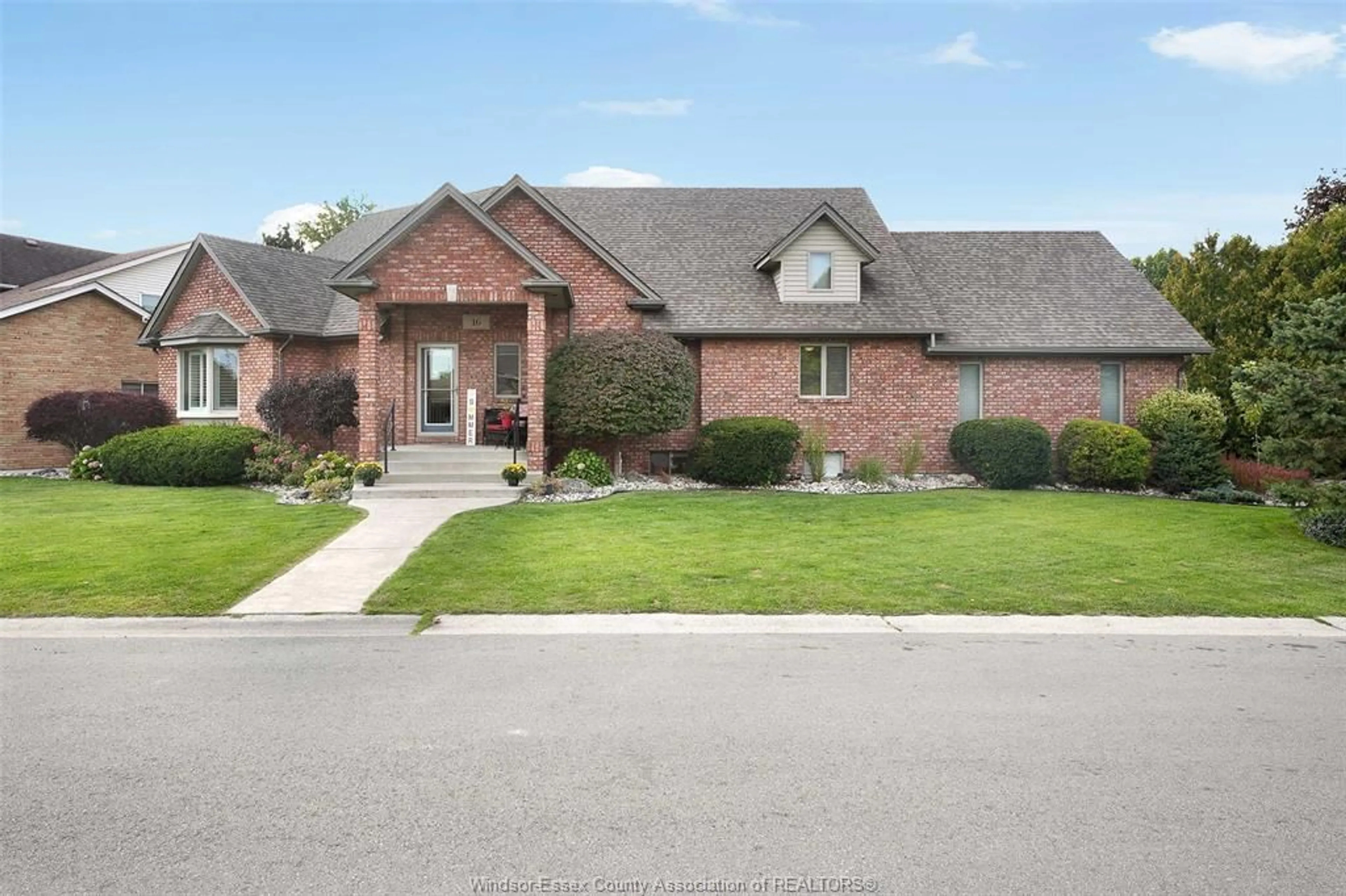 Home with brick exterior material, street for 16 MEADOW LANE, Essex Ontario N8M 3C5