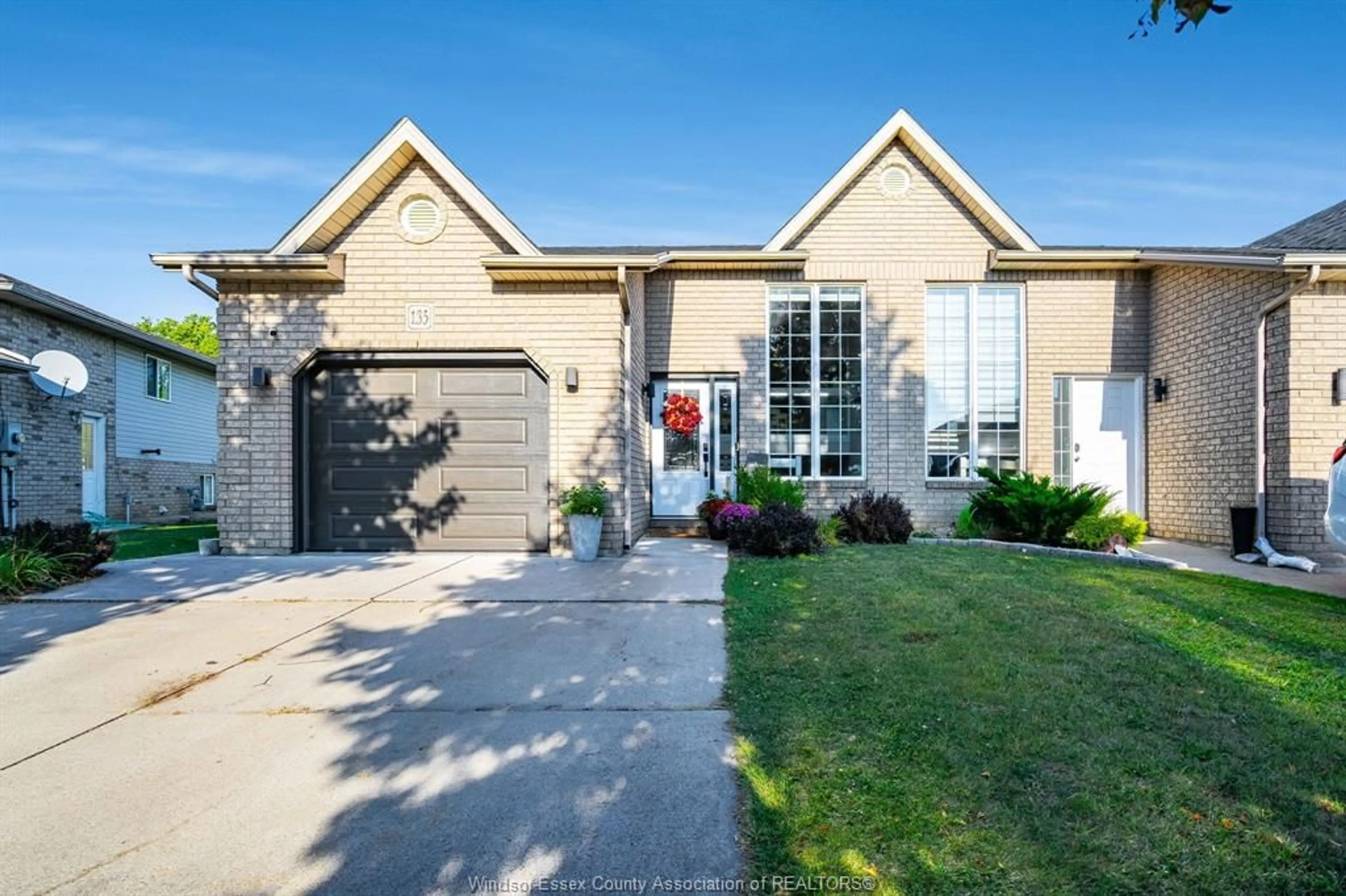 Home with brick exterior material, street for 135 Sturgeon Meadows Ave, Leamington Ontario N8H 5L1