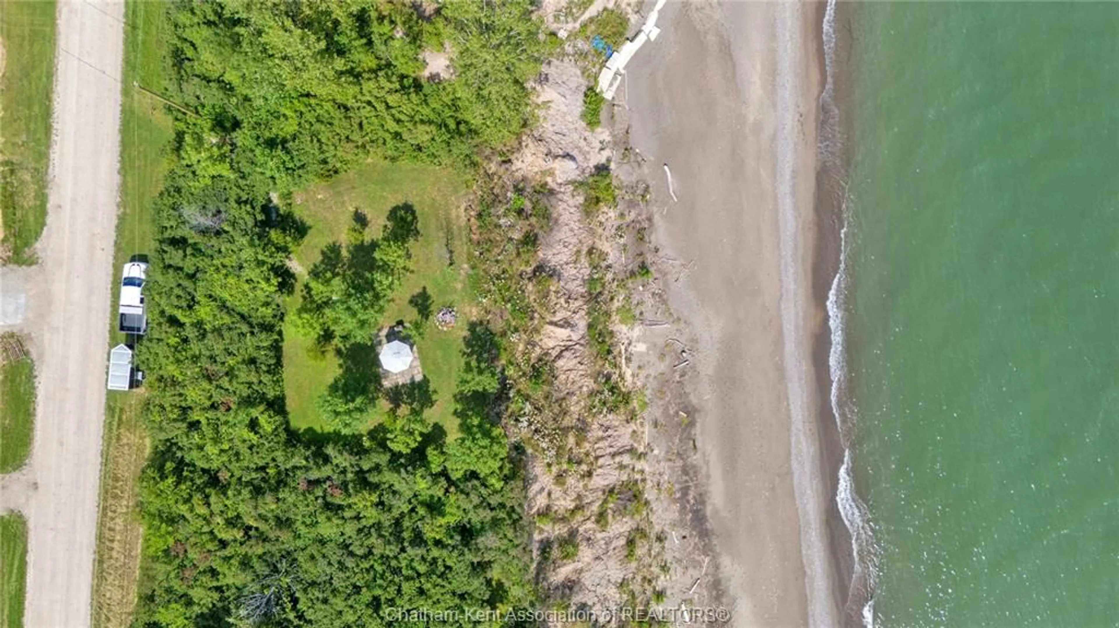 A pic from outside/outdoor area/front of a property/back of a property/a pic from drone, water/lake/river/ocean view for 1311 Bluff Line, Wheatley Ontario N0P 2P0