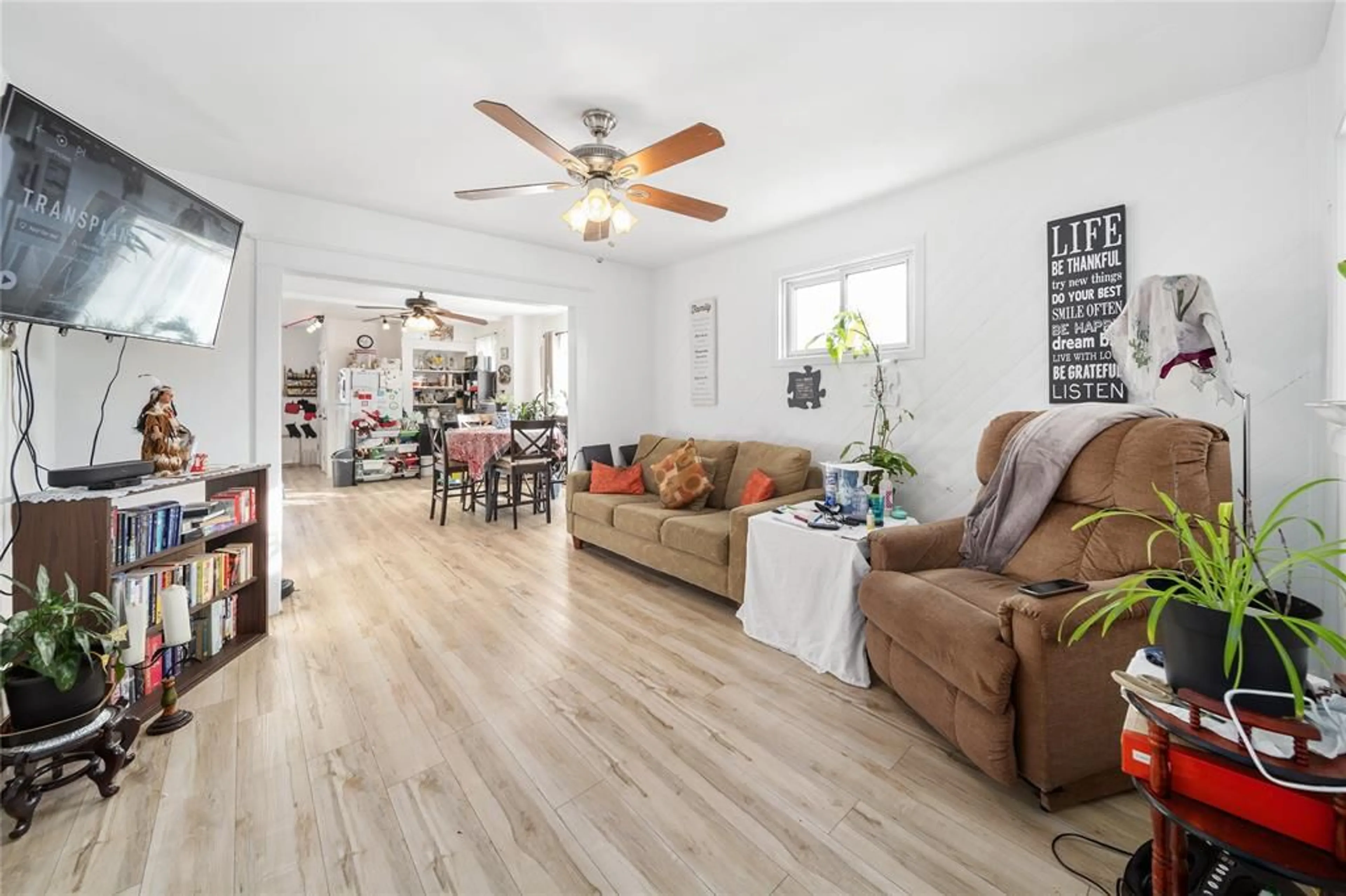 Living room with furniture, wood/laminate floor for 246 RUSSELL St, Sarnia Ontario N7T 3L8