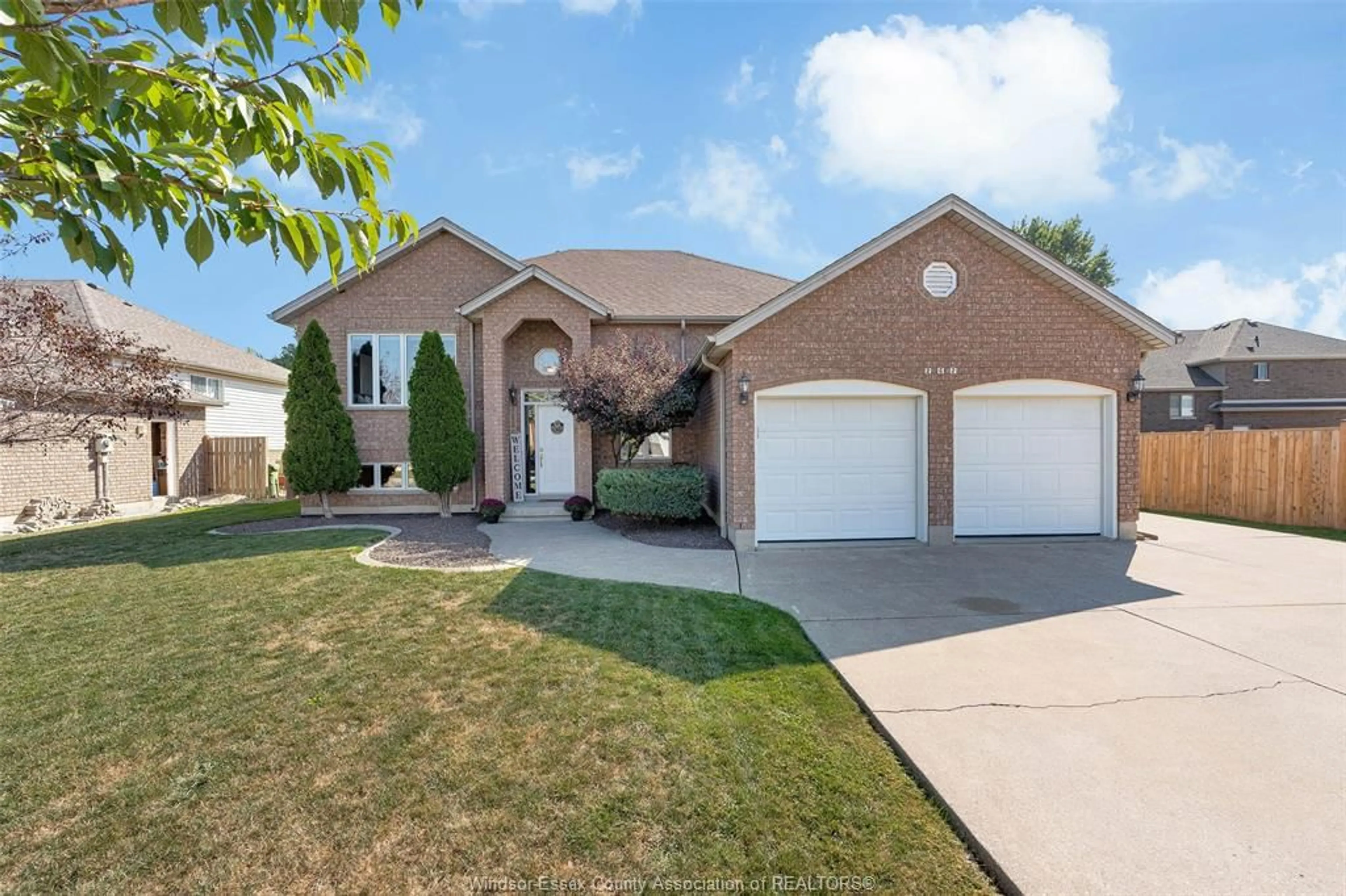 Home with brick exterior material, street for 262 COLUMBUS Dr, Lakeshore Ontario N0R 1N0