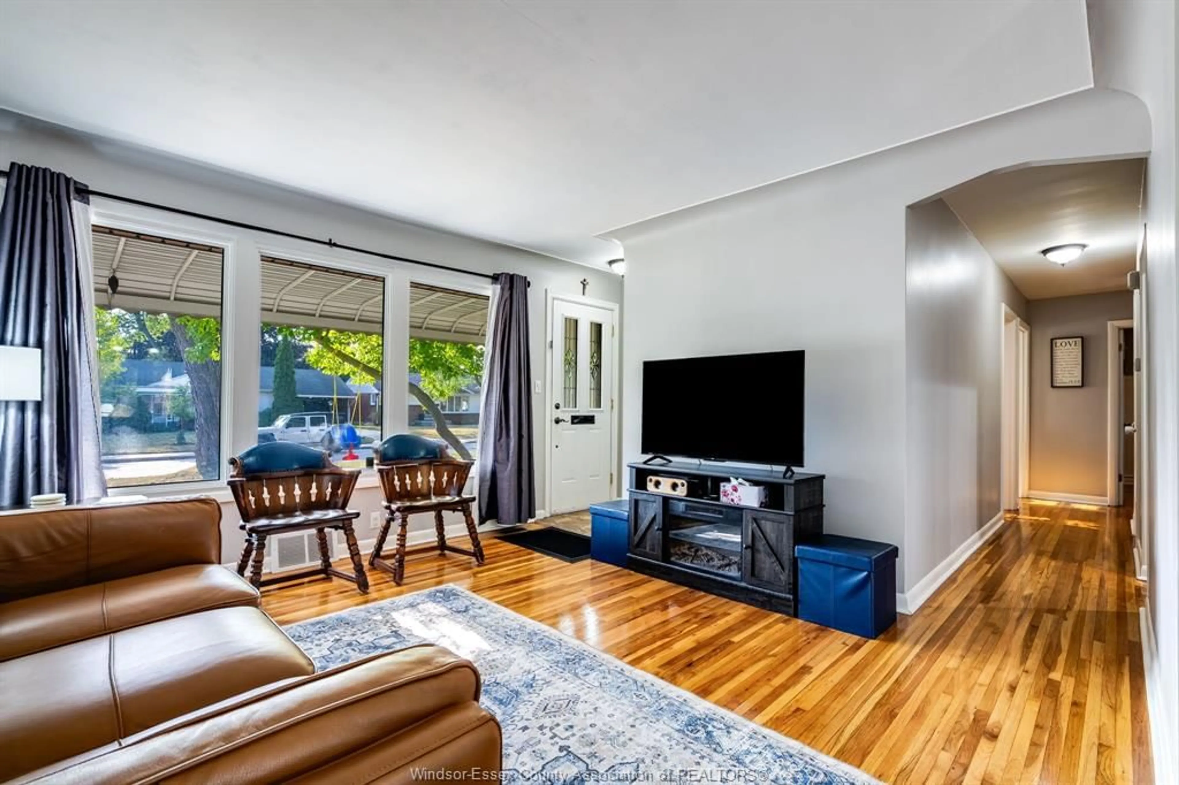 Living room with furniture, wood/laminate floor for 3260 Everts Ave, Windsor Ontario N9E 2V8