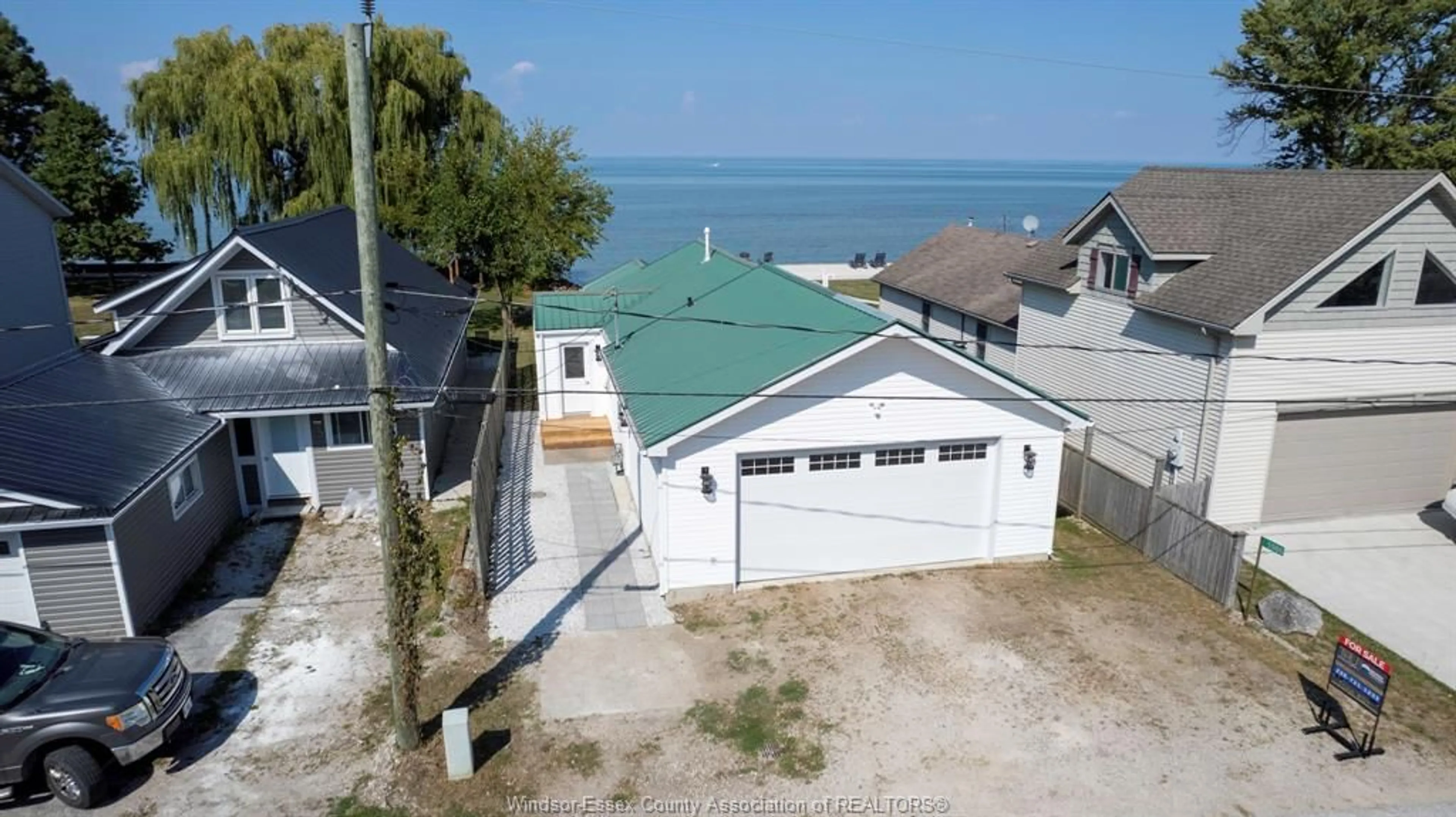 A pic from outside/outdoor area/front of a property/back of a property/a pic from drone, water/lake/river/ocean view for 1564 Caille Ave, Lakeshore Ontario N8L 0J3