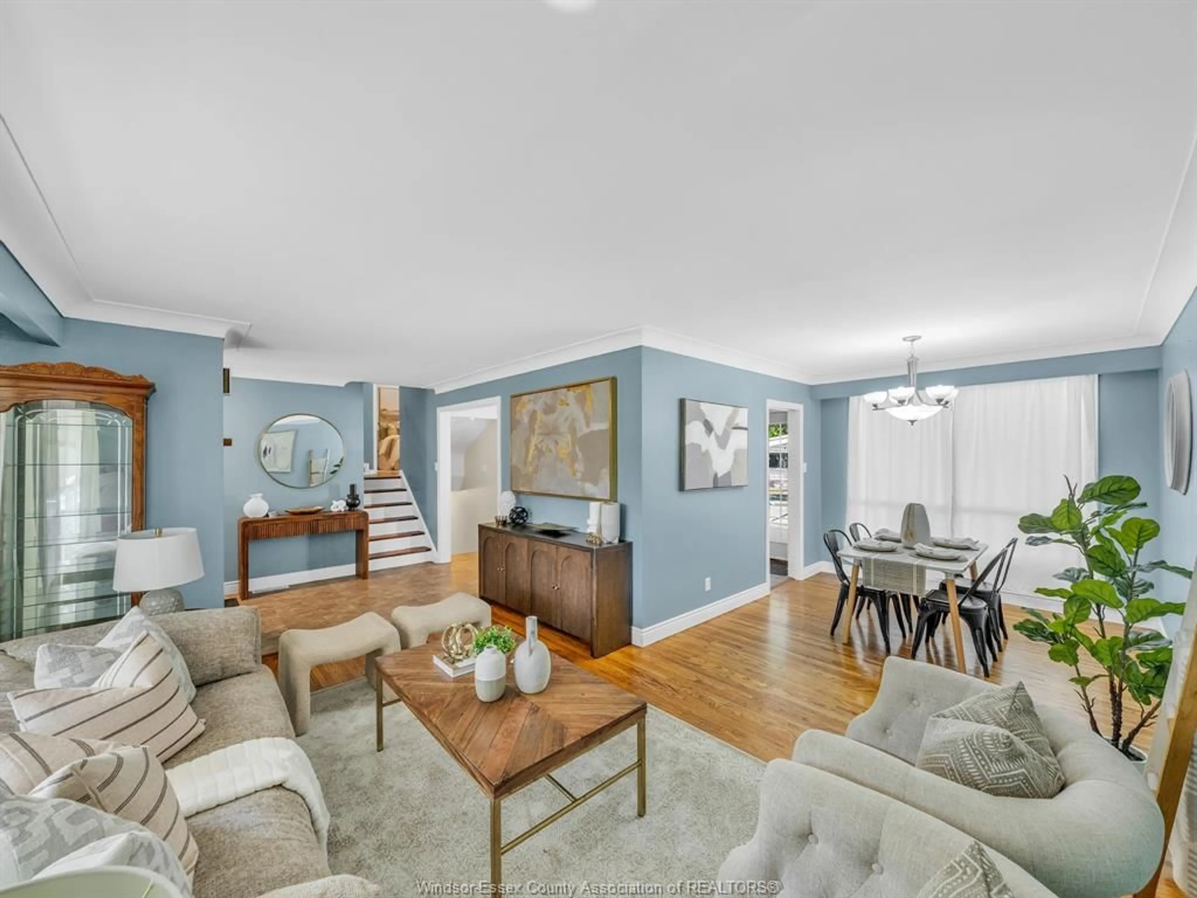 Living room with furniture, wood/laminate floor for 3379 Askin Ave, Windsor Ontario N9E 3J6