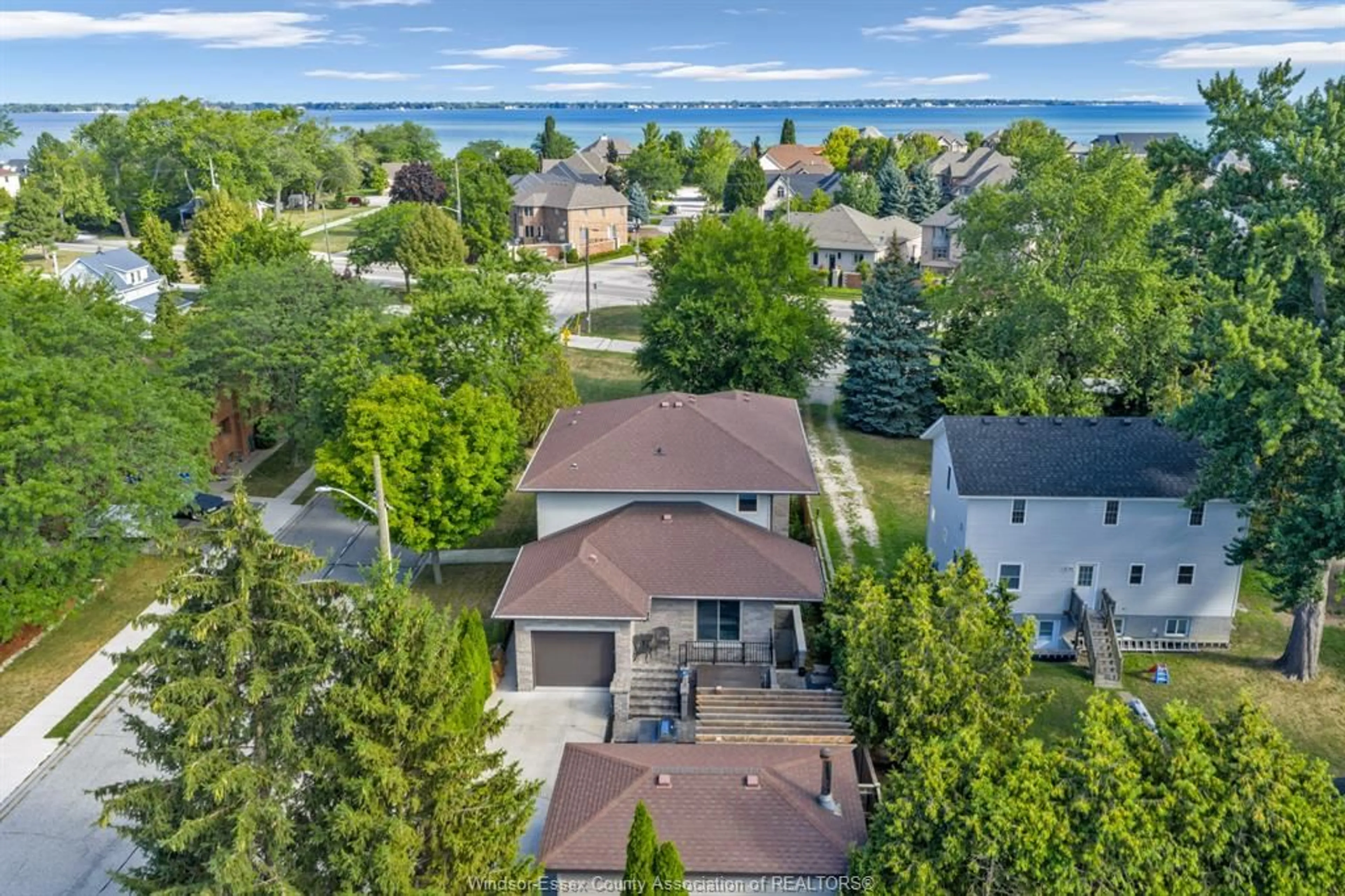 A pic from outside/outdoor area/front of a property/back of a property/a pic from drone, unknown for 11965 RIVERSIDE Dr, Windsor Ontario N8P 1A8