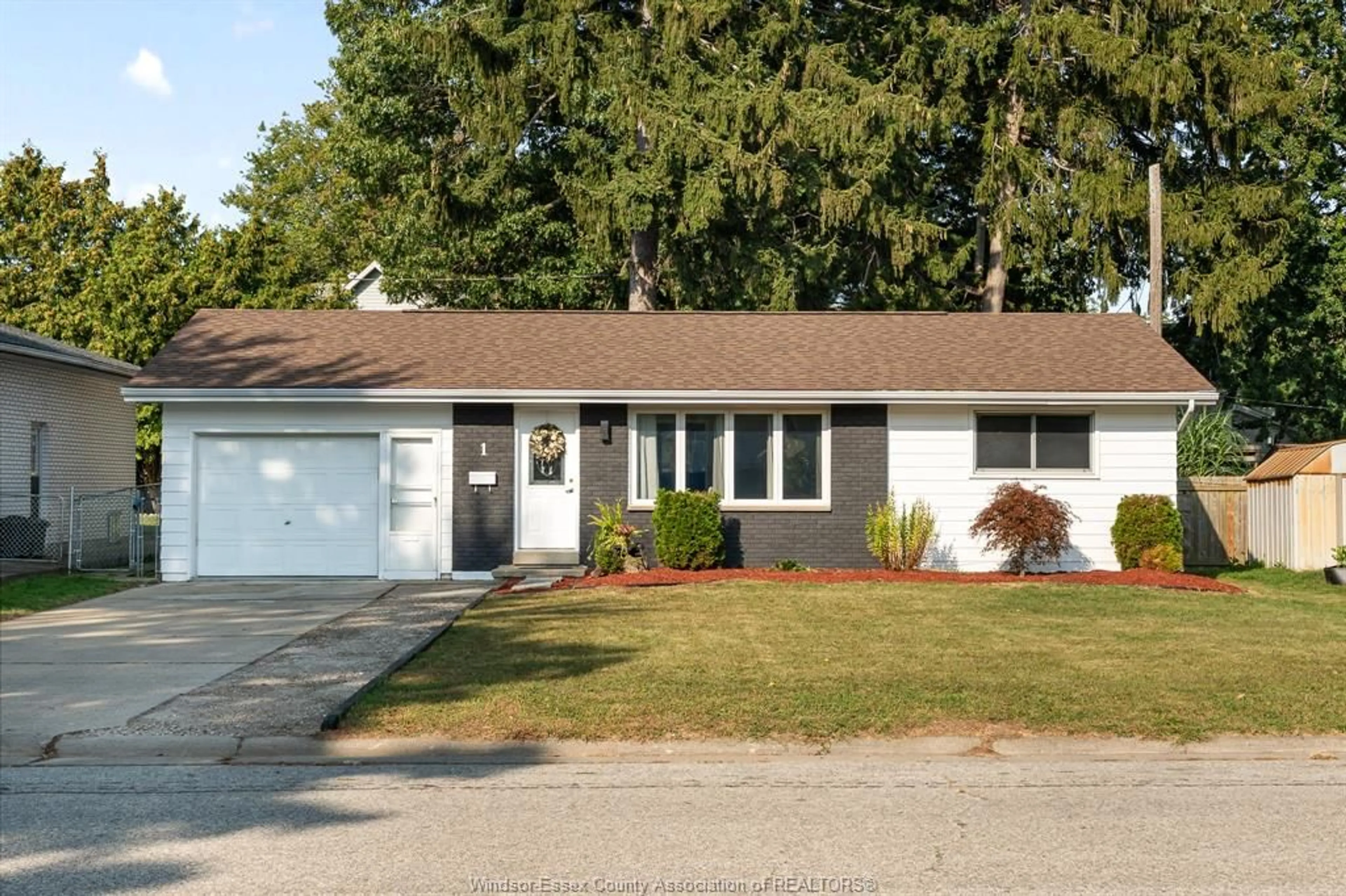 Home with vinyl exterior material, street for 1 LONGFIELD Lane, Leamington Ontario N8H 2R8