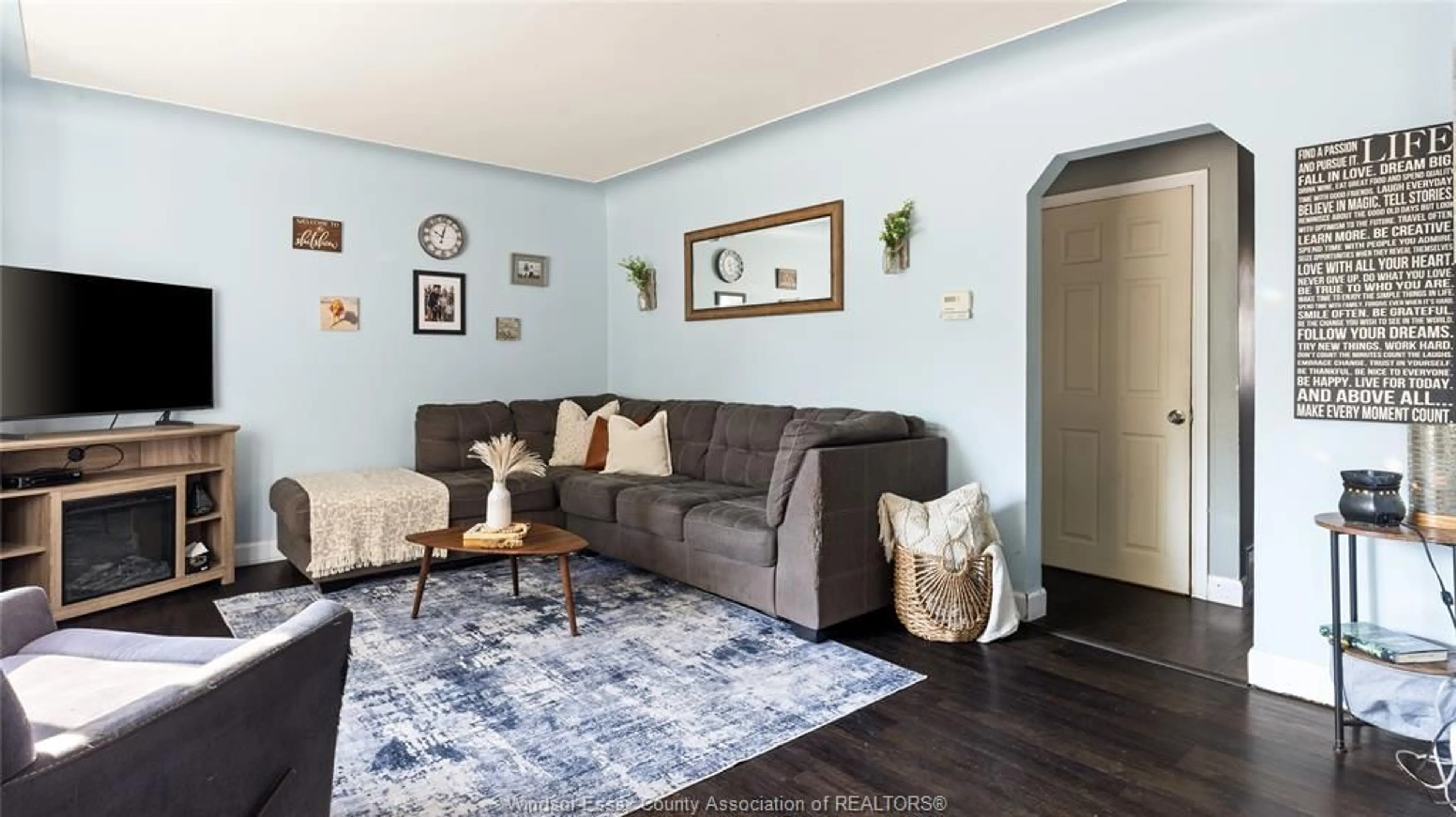 Living room with furniture, wood/laminate floor for 1039 VILLAIRE, Windsor Ontario N8S 2J7