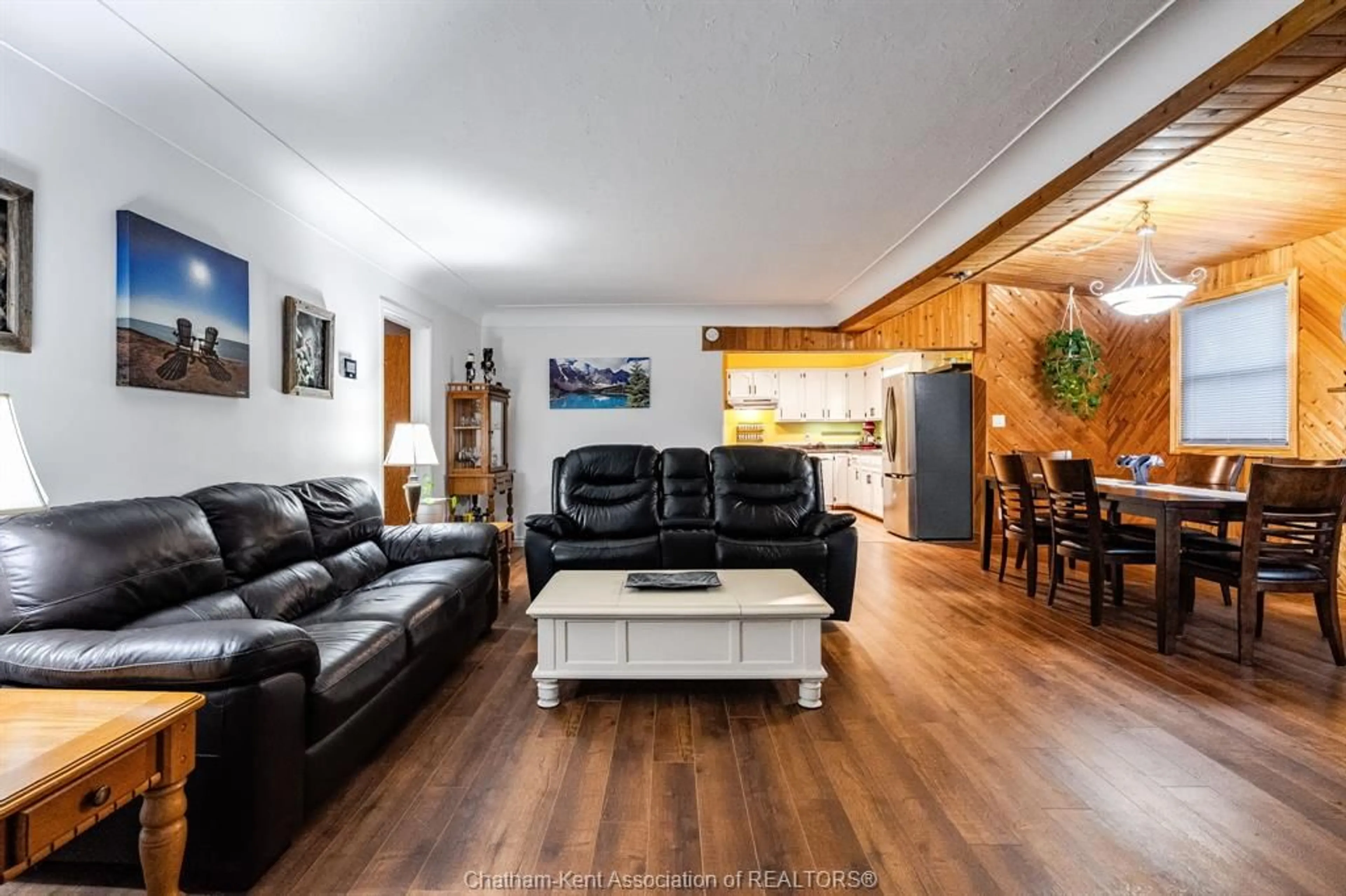 Living room with furniture, wood/laminate floor for 85 Sheldon Ave, Chatham Ontario N7L 3M8