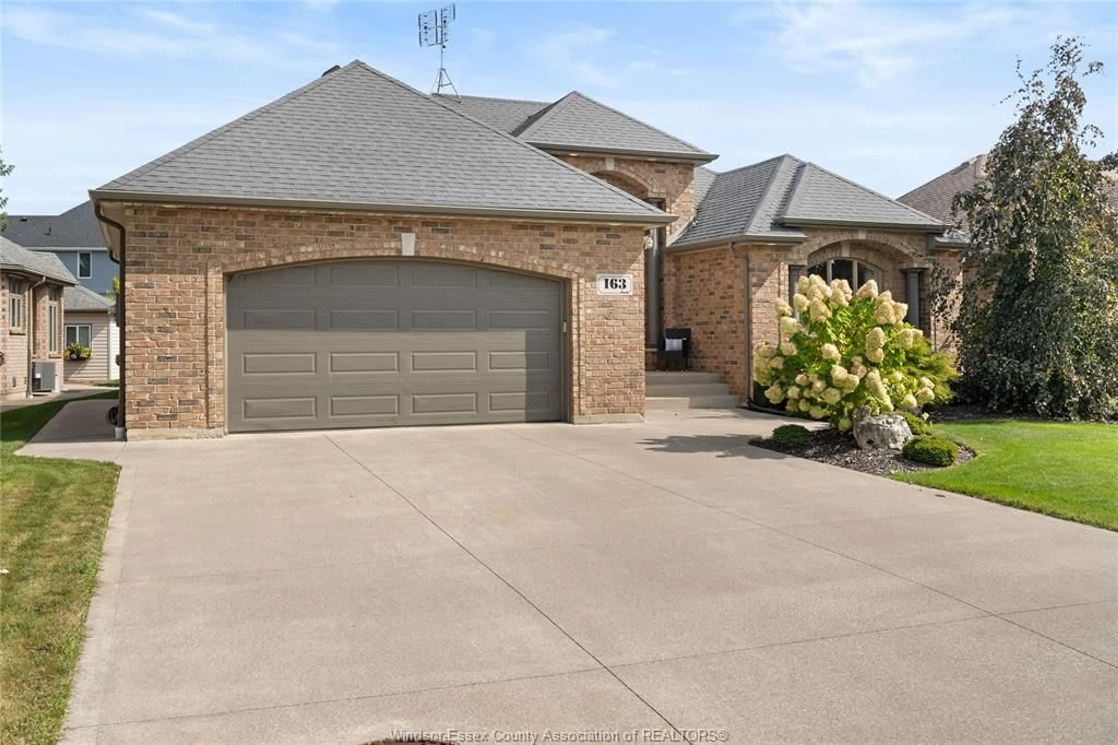 Home with brick exterior material, street for 163 WOODYCREST, Kingsville Ontario N9Y 0A1