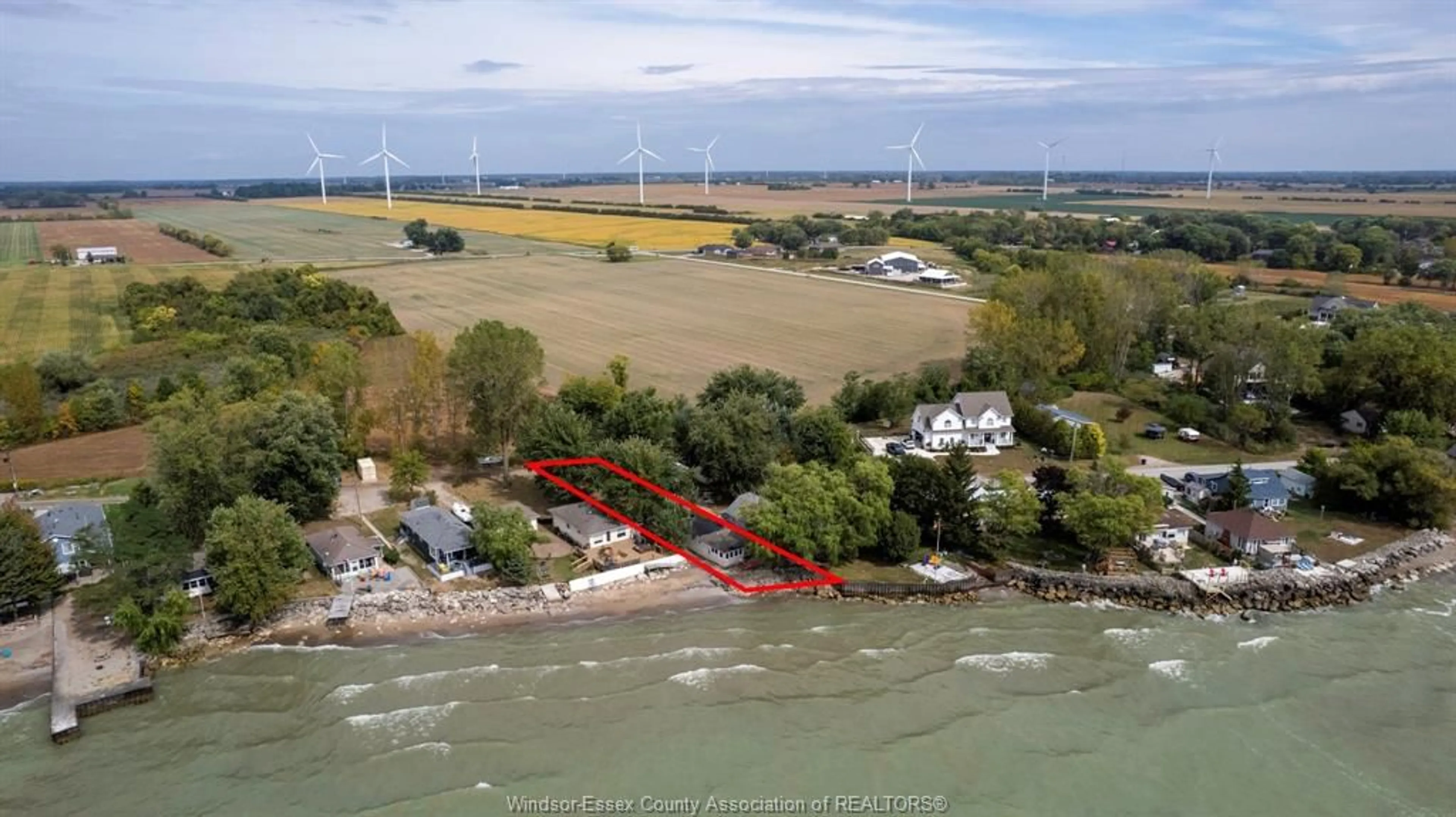 A pic from outside/outdoor area/front of a property/back of a property/a pic from drone, water/lake/river/ocean view for 835 ERIE BLUE, Harrow Ontario N0R 1G0