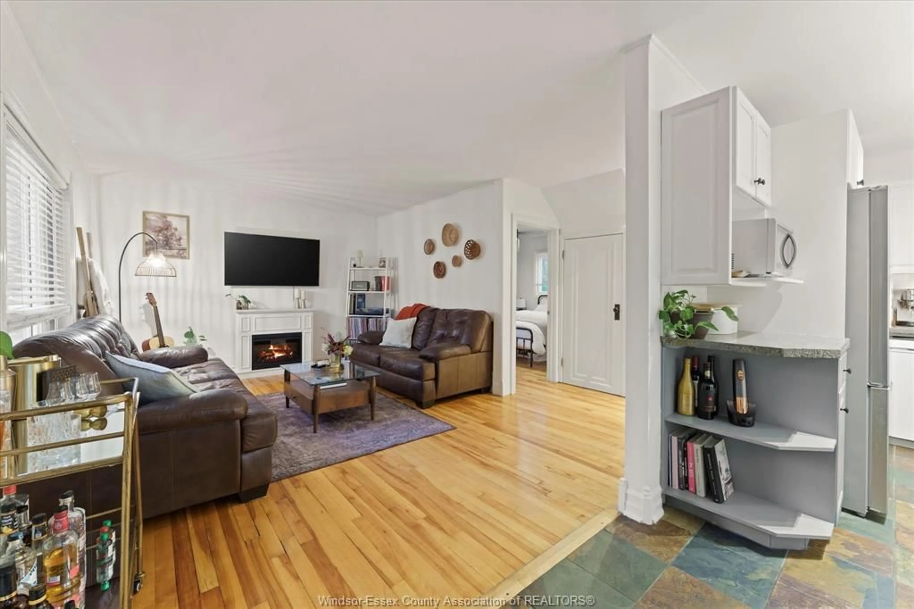 Living room with furniture, wood/laminate floor for 1321 TOURANGEAU, Windsor Ontario N8Y 4J1