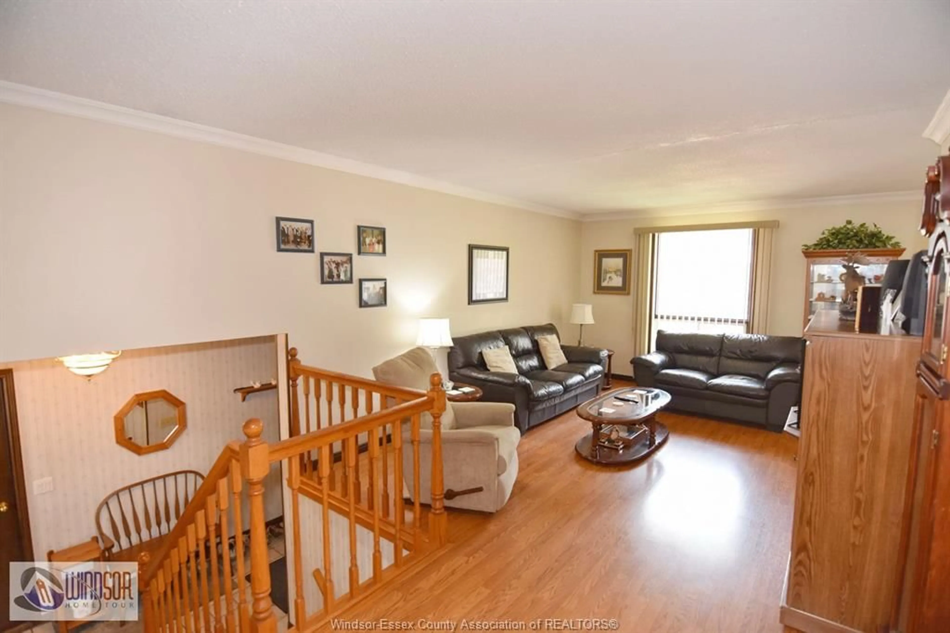 Living room with furniture, wood/laminate floor for 3712 BLISS Rd, Windsor Ontario N8W 3C2