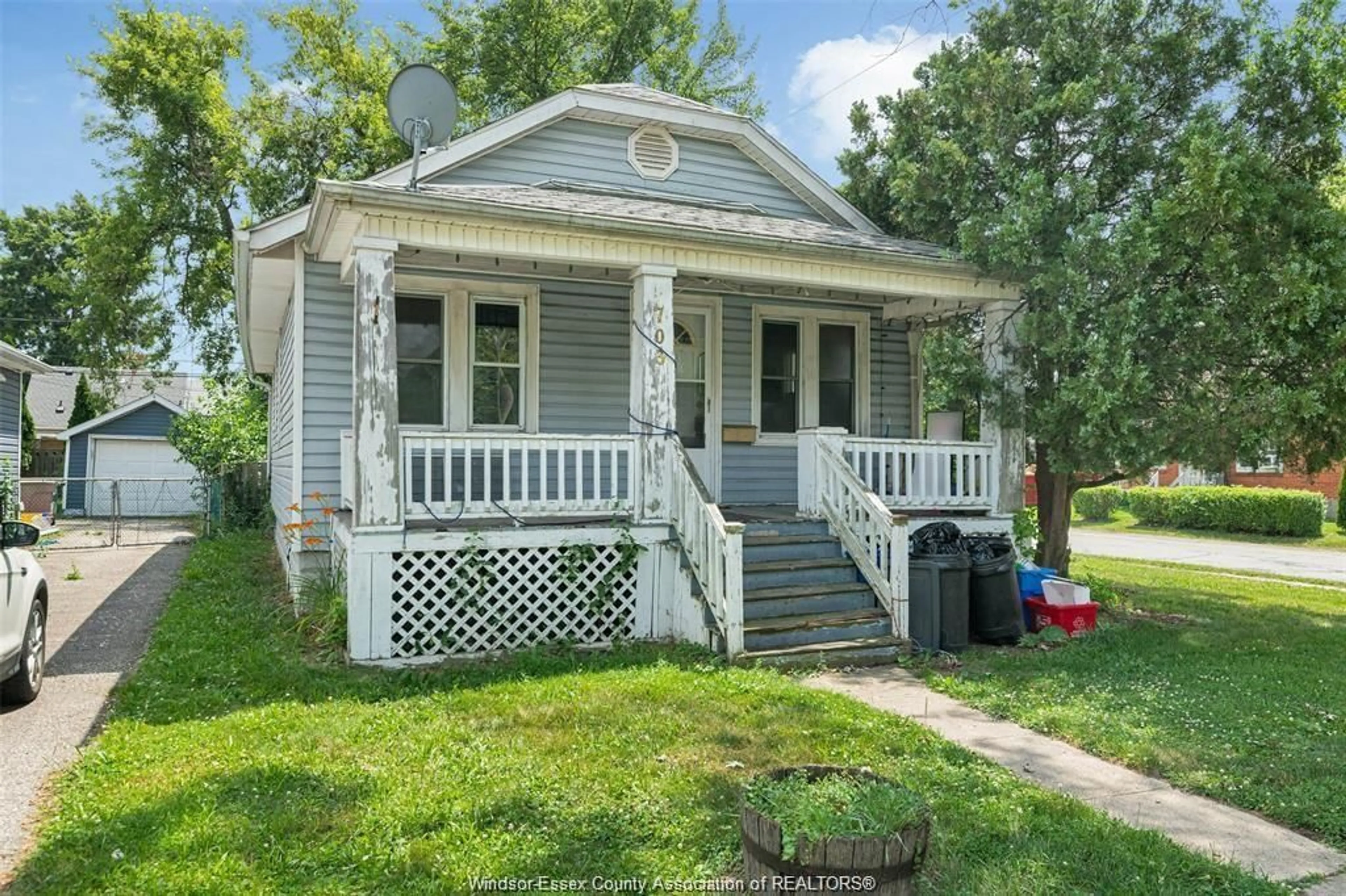 Home with vinyl exterior material, street for 703 CHARLOTTE St, Windsor Ontario N8X 3A7