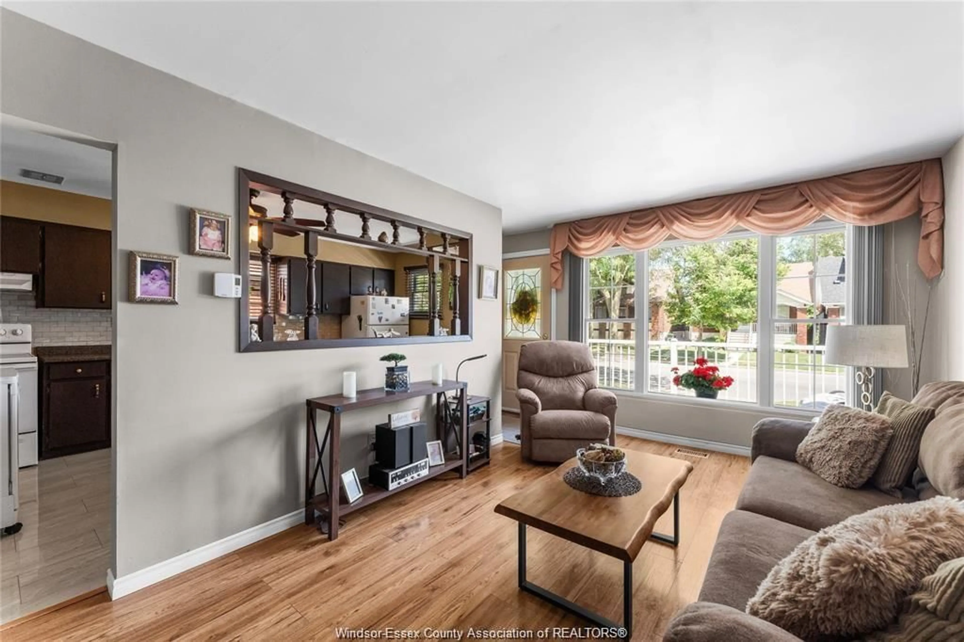 Living room with furniture, wood/laminate floor for 1087 CAMPBELL Ave, Windsor Ontario N9B 2J4