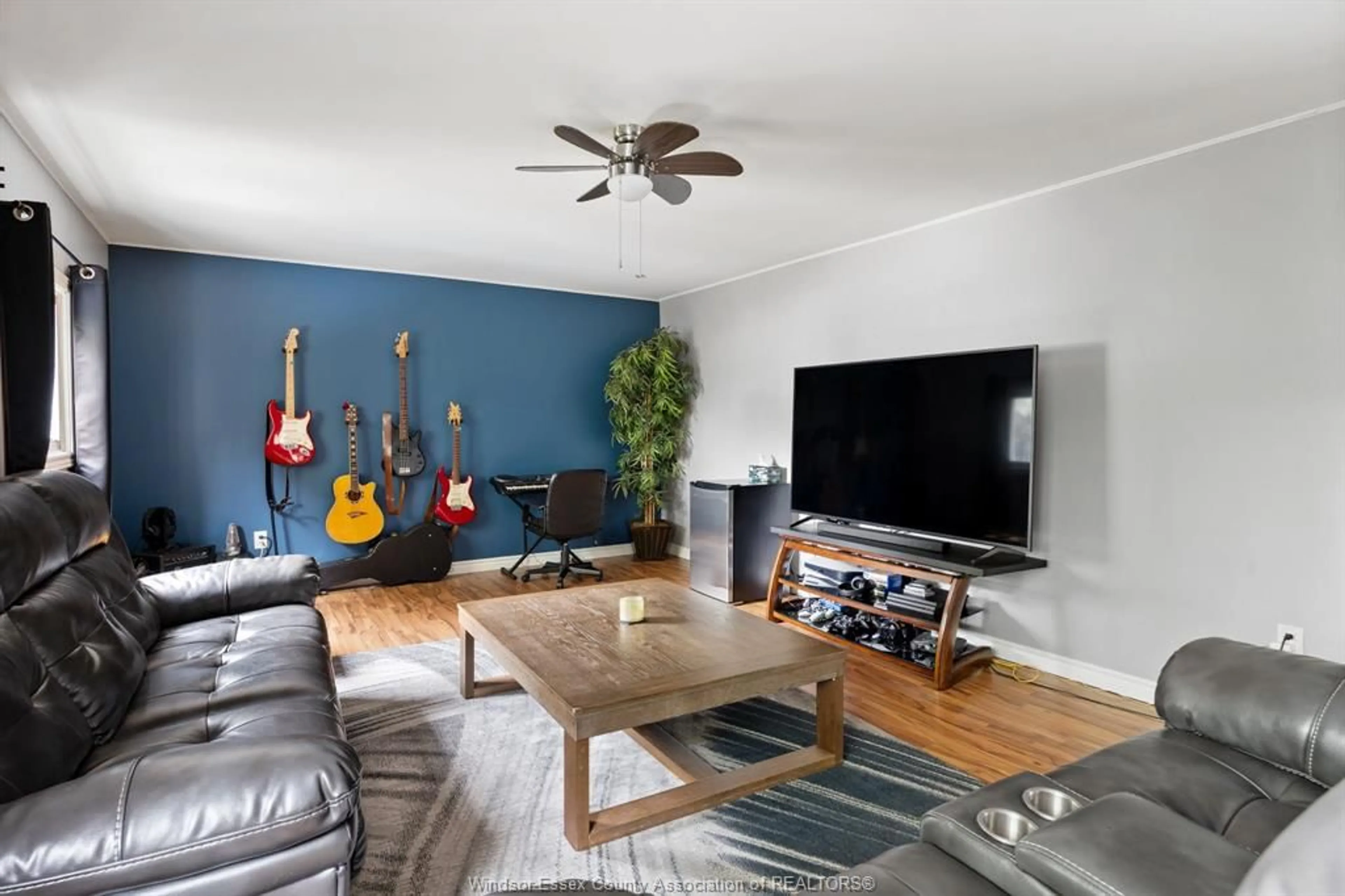 Living room with furniture, wood/laminate floor for 1824 WESTCOTT Rd, Windsor Ontario N8W 4K2