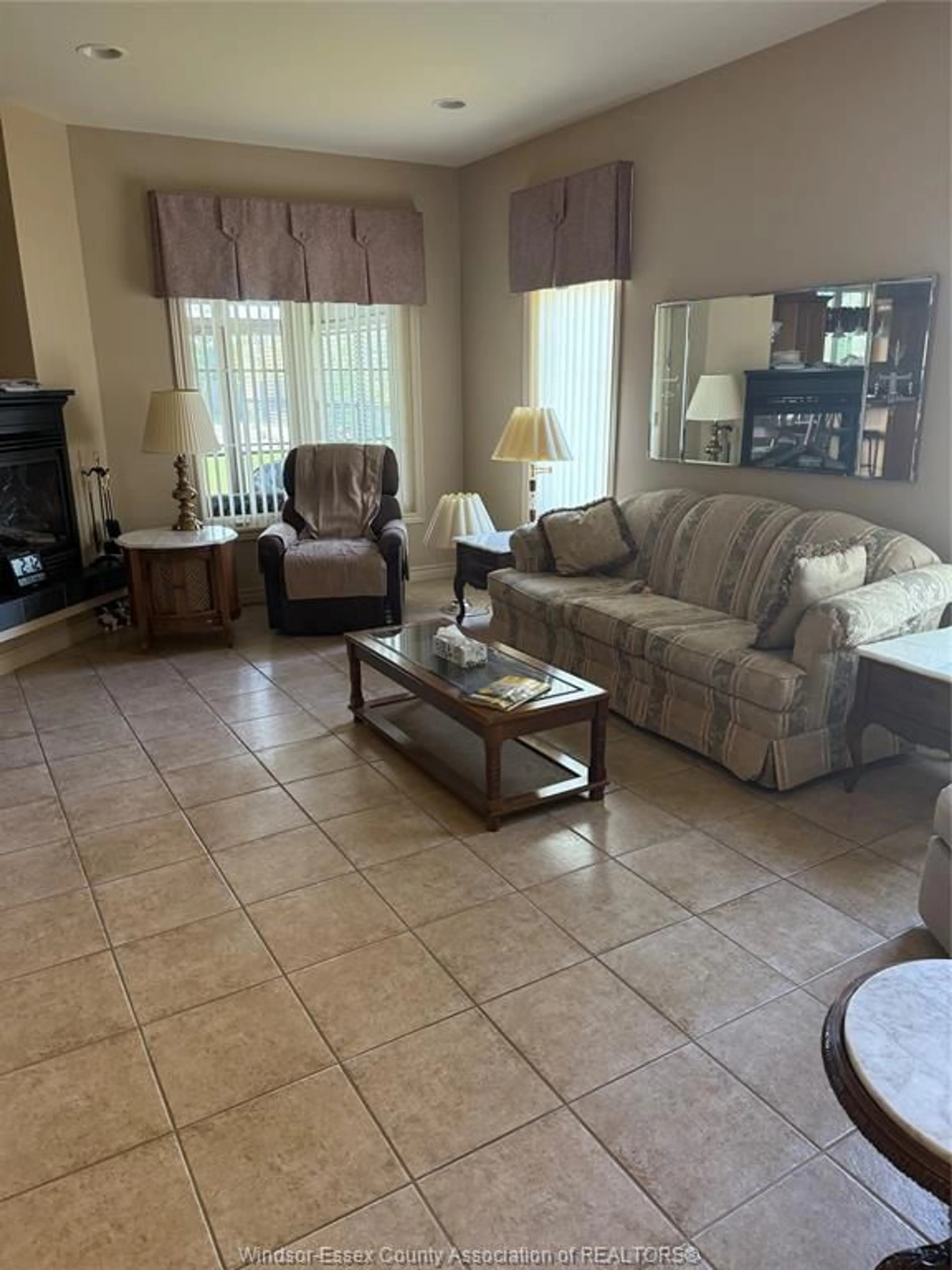 Living room with furniture, ceramic/tile floor for 203 WHISPER CREEK Cir, Lakeshore Ontario N9J 1G3