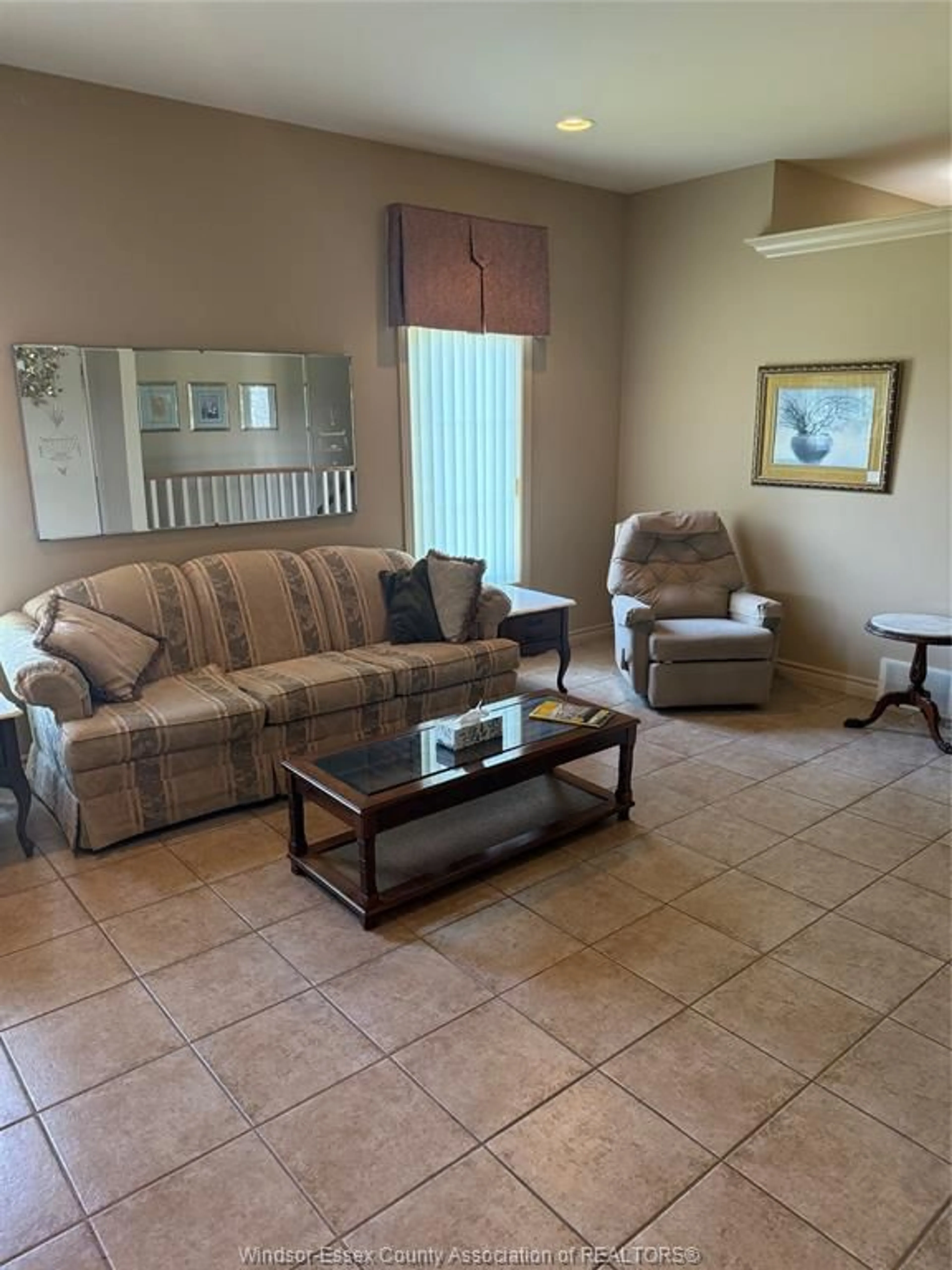 Living room with furniture, ceramic/tile floor for 203 WHISPER CREEK Cir, Lakeshore Ontario N9J 1G3