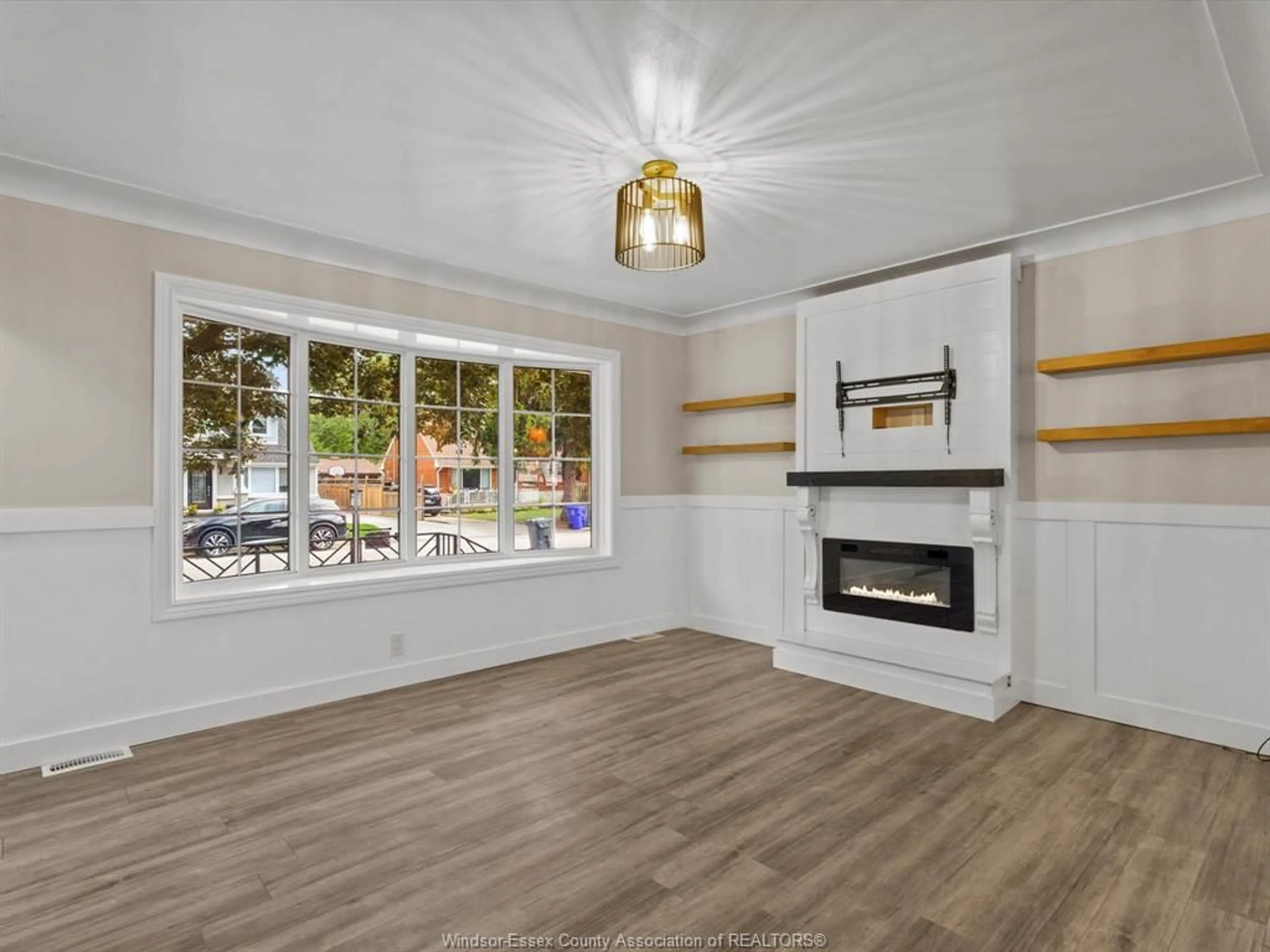 Living room with furniture, wood/laminate floor for 1137 REEDMERE, Windsor Ontario N8S 2M2