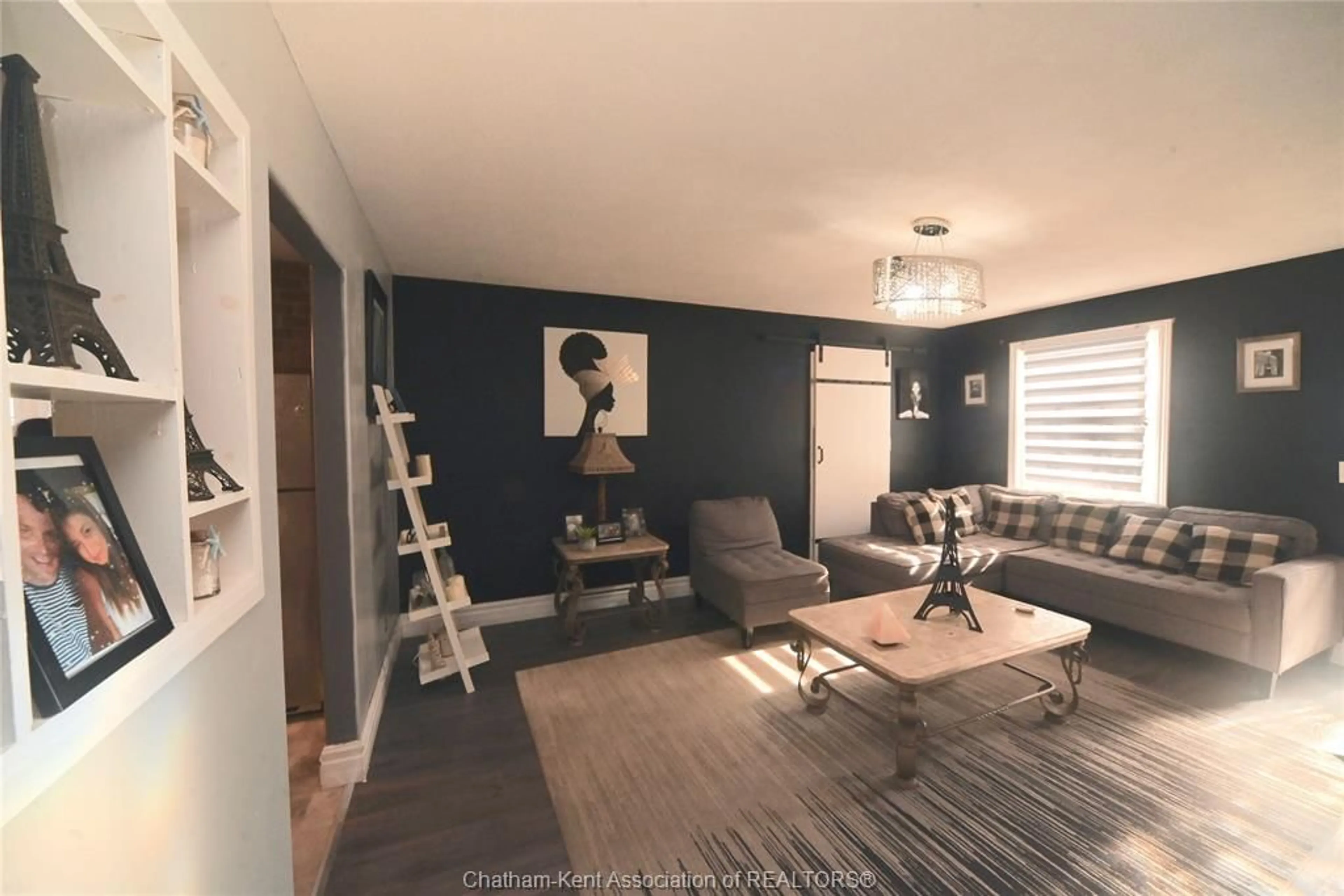 Living room with furniture, wood/laminate floor for 57 Church St, Blenheim Ontario N0P 1A0