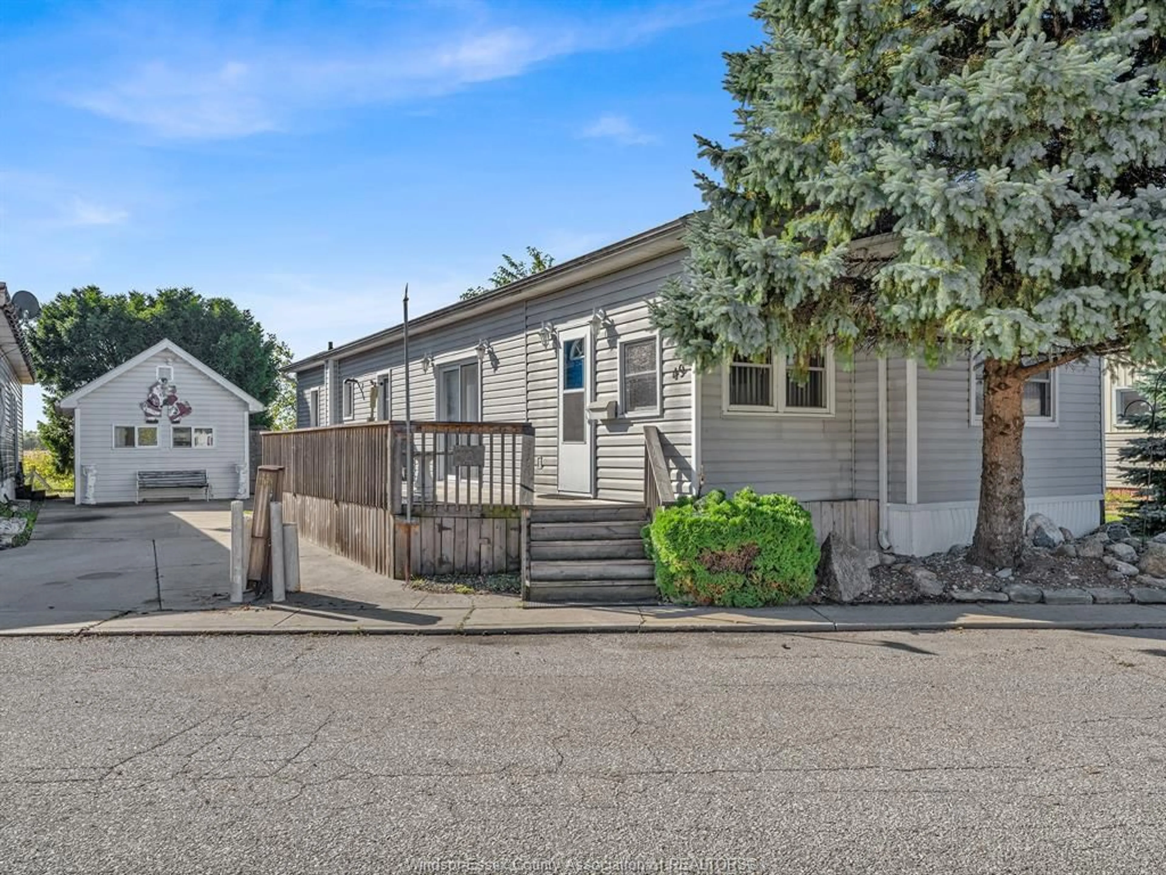 Home with vinyl exterior material, street for 49 WILDER Dr, Lakeshore Ontario N8N 2T1