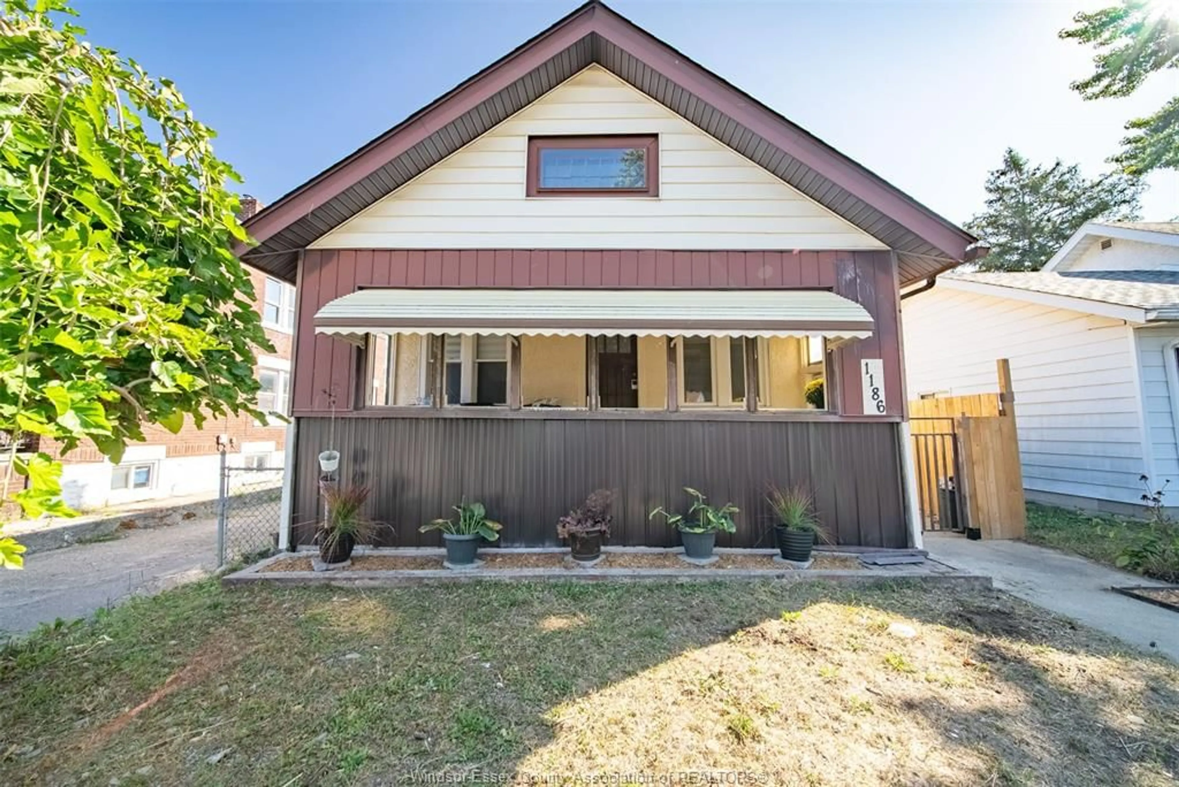 Home with vinyl exterior material, street for 1186 PIERRE Ave, Windsor Ontario N9A 2L4
