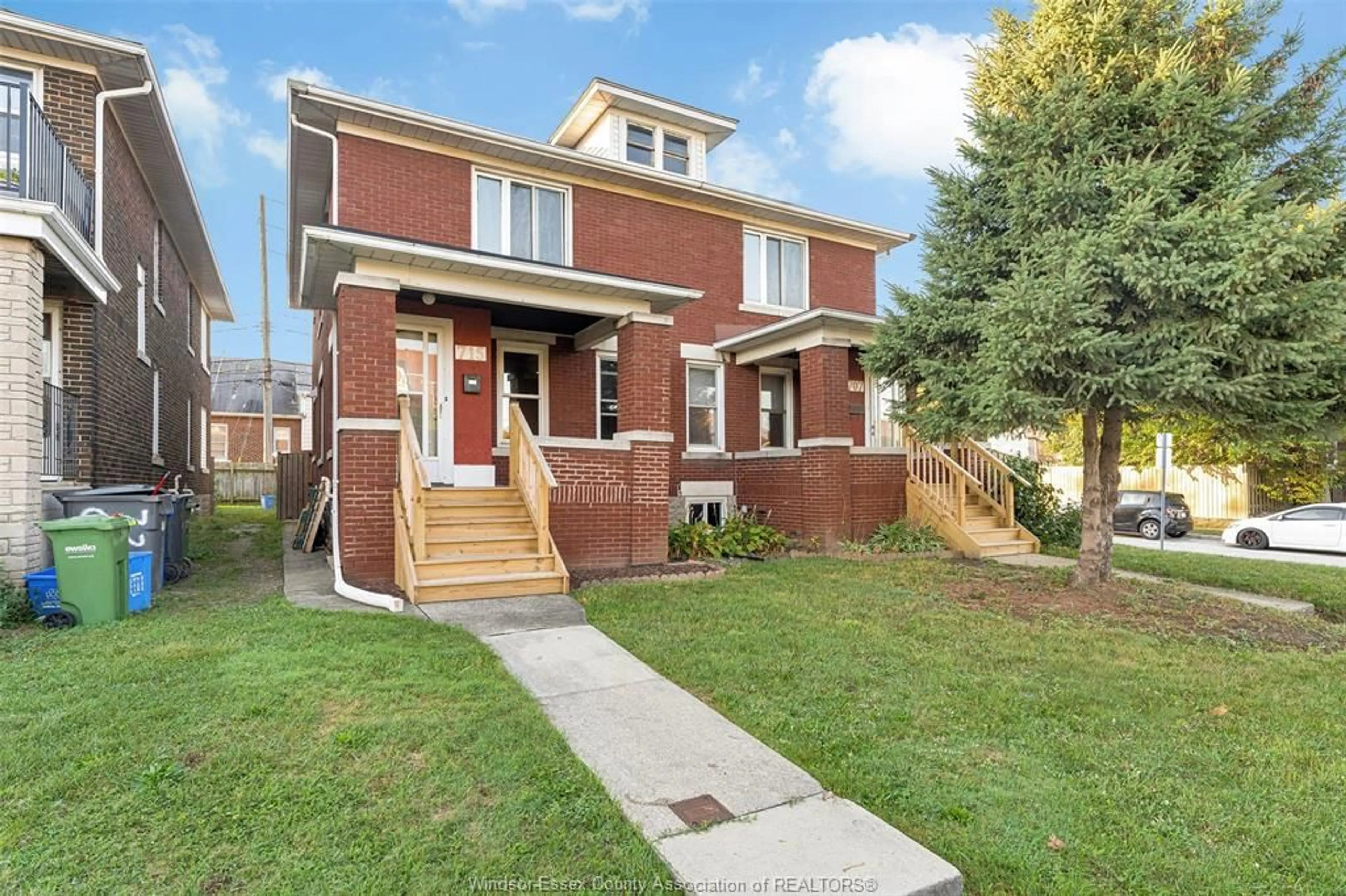 Home with brick exterior material, street for 707-715 GILES Blvd, Windsor Ontario N9A 4E5