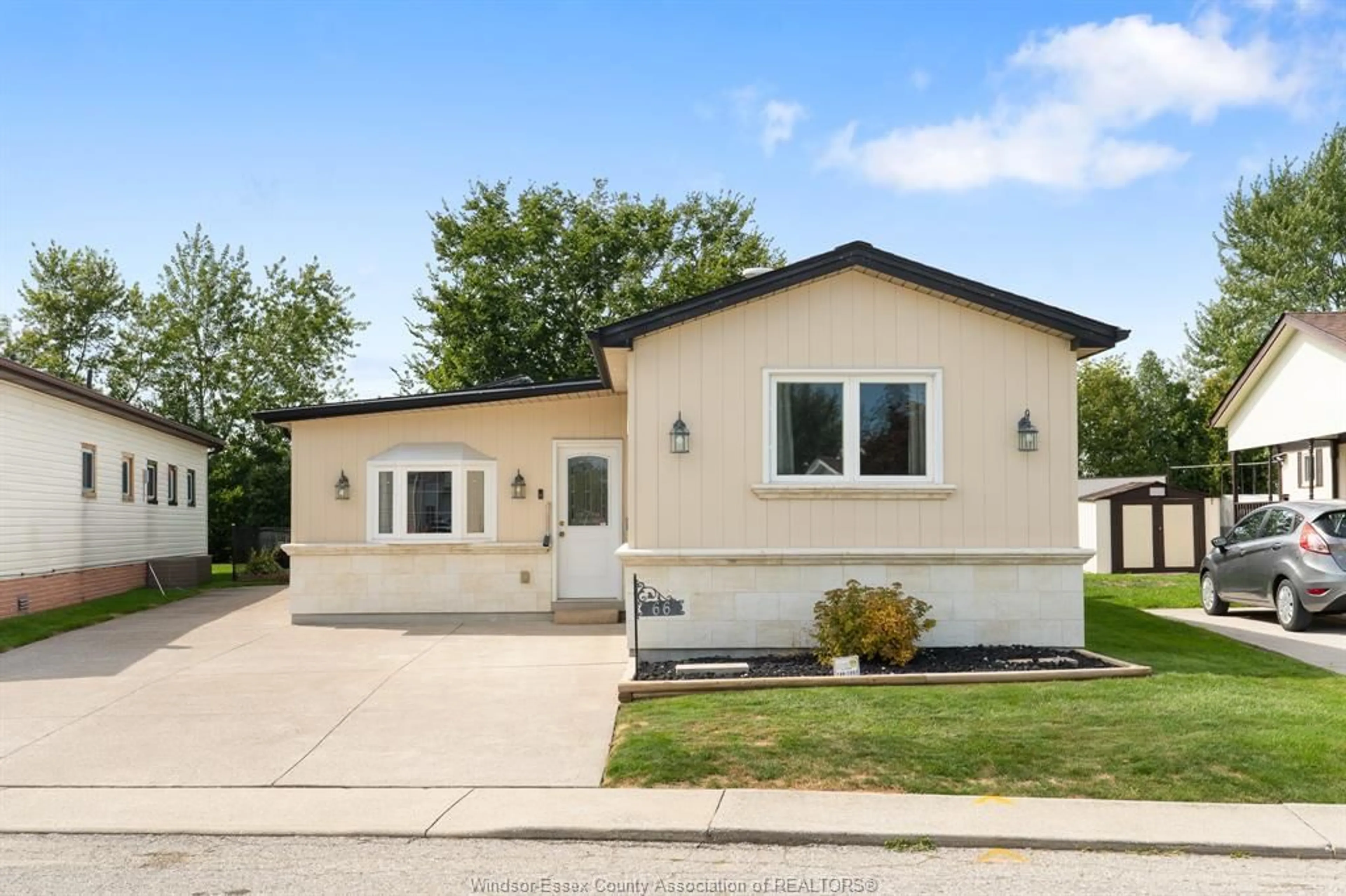 Home with vinyl exterior material, street for 66 Parkside Dr, Essex Ontario N0R 1J0